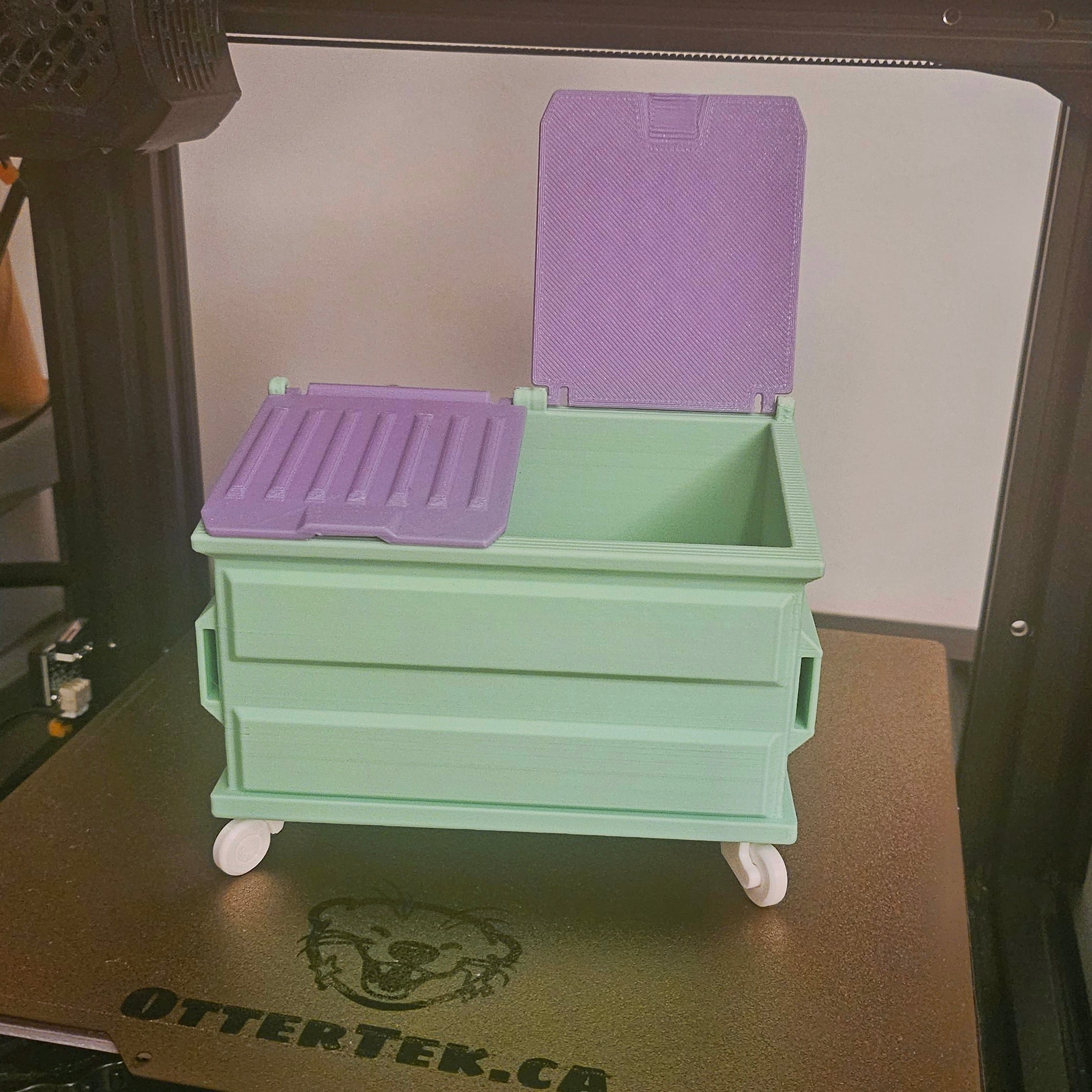 This was one of the first things I printed once I had the printer settings figured out so I would have a place to toss my many expected printing failures without leaving my desk. One of the hinges on the dumpster did break when I was trying to push the lid in but I just superglued it back on and it isn't noticeable. I may have pushed too hard or used too brittle a filament.
Anyway I made it for its life-sized purpose so...... It works great! It's literally a little garbage can and you can put little bits of garbage in it. 10/10
