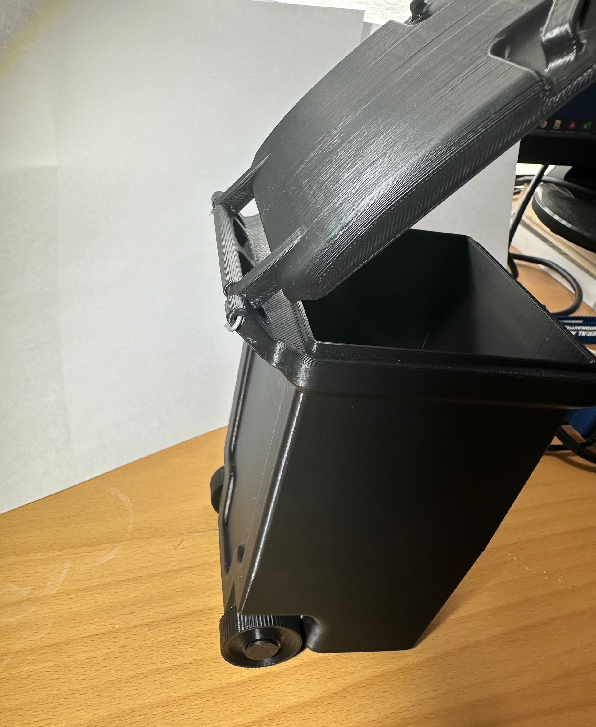Printed the variant without the recycle symbol. Very nice print. Wheels and lid work well. Flattened and trimmed a paperclip for the hinge. Did this one as a gift. May print another to keep for myself.