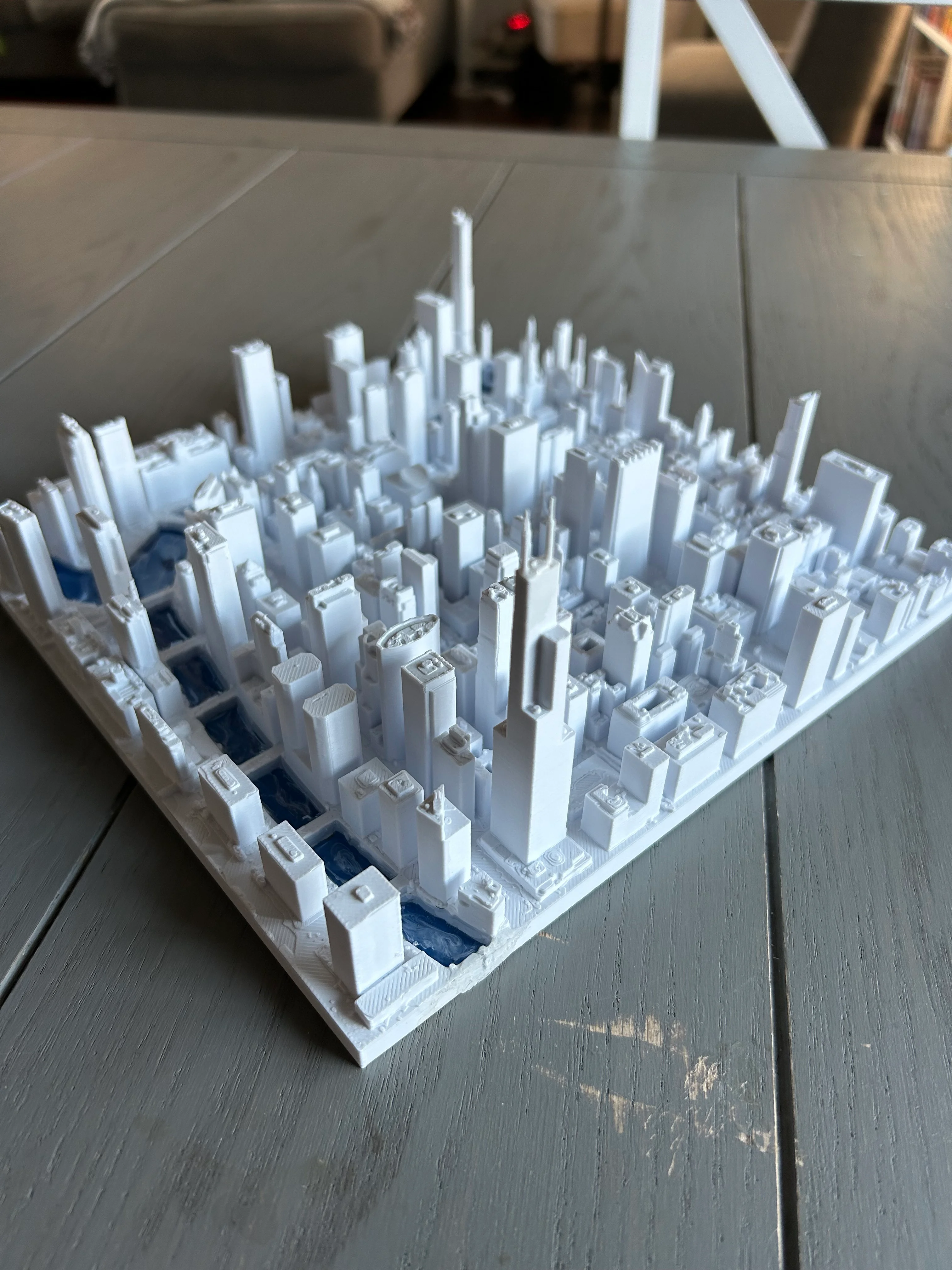 Awesome print. It comes out great. Soooo much detail. I’m highly impressed with the model. Definitely be careful with the Sears Tower antennas. The Trump tower antenna was too small to print for the size I chose (approx. 220x220). I painted the river with blue on the bottom and poured epoxy on top. Now to make a frame.