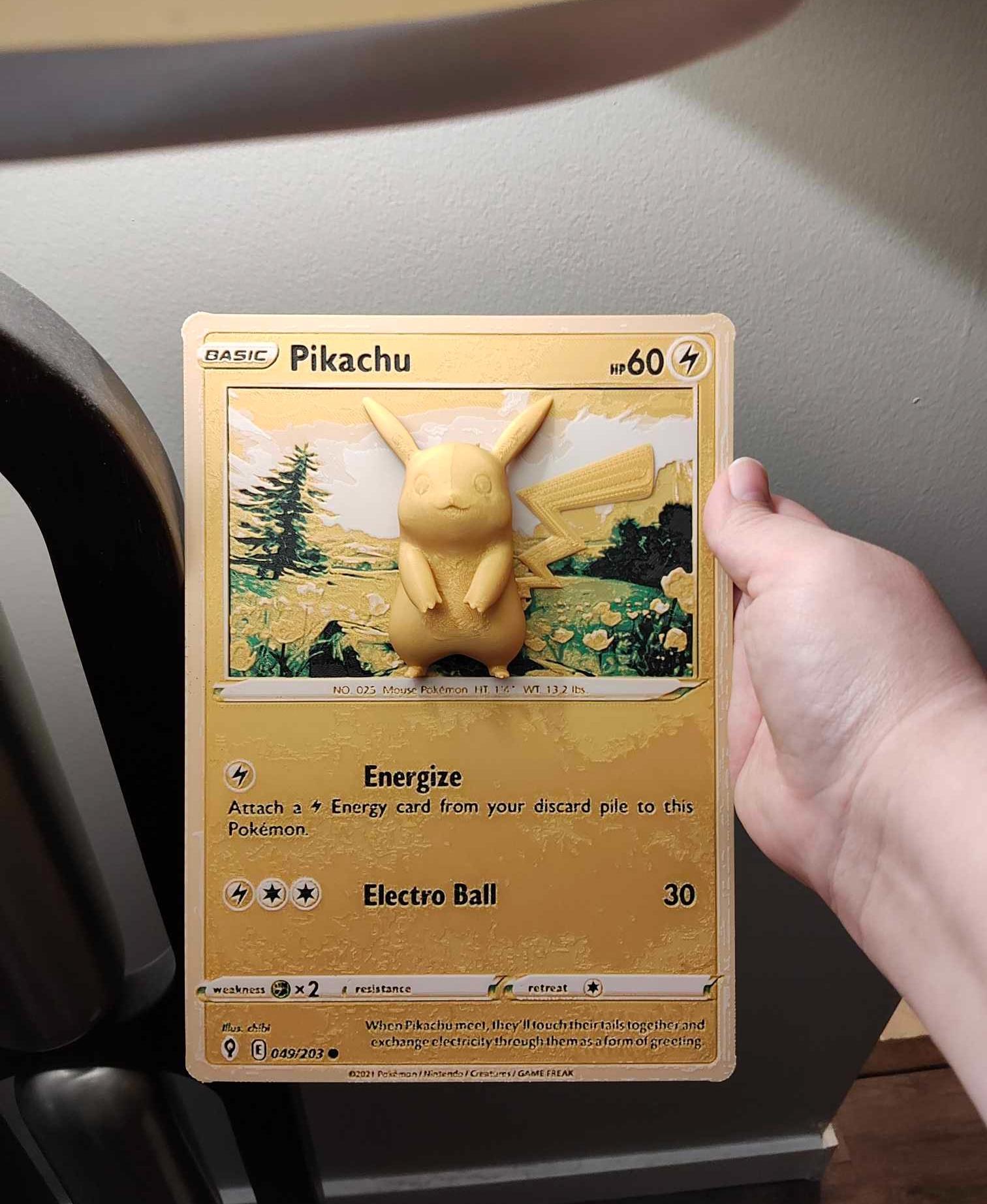 Oversized Pikachu Pokemon Card - Hueforge Hybrid Print - If I printed it again, I would reduce flow percentage a bit and also use a modifier shape to change the top surface infill pattern to concentric. 

The Pikachu's stomach and the base of the ears is a bit rough because of the kind of infill chosen, but this is easily fixed. 

This is one reason I rarely just print from someone's pre-determined 3mf without modification, but in this case I just hit print without a full inspection, so my bad.

Overall though not bad, and certainly good enough for me. - 3d model