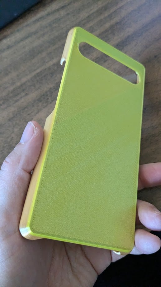 Good print design. About a mm too long (perhaps necessary). Protects camera lens but my screen touches tabletop when stored upside down. Wish sides taller.
