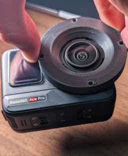 Insta360 Ace Pro Lens Mounting Plate - Ace Pro being held up by the mounting plate, printed in PLA Plus with no post-processing. The mount is very secure, but additional post-processing or a stronger material is still a good idea. - 3d model