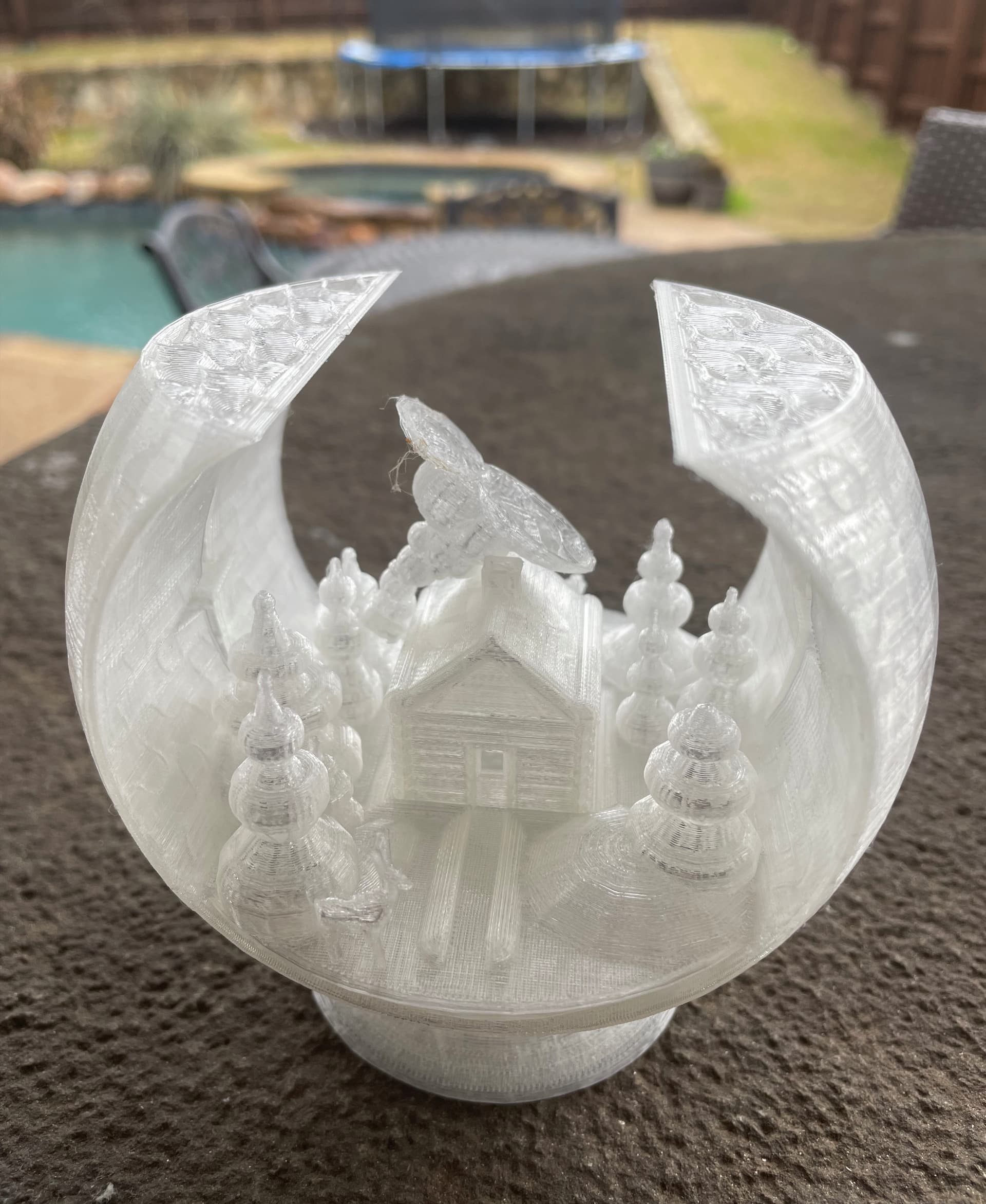 Chimney broke off the roof only a layer or 2 before it was going to connect with the top part of the globe and reinforce it :( :( -- about 14 hours into print.. I tried to superglue, and modified the gcode to resume at that layer, but the superglue didn't hold up and broke again.. So bummed, this was gonna look so cook in clear PLA :(