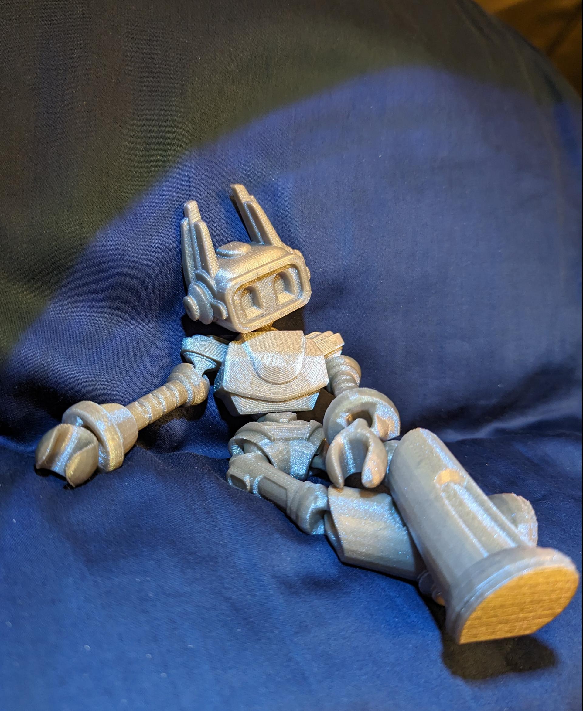 ZILLOLAAB - ZIPPY THE BOT 🤖 - Zippy the bot relaxing on the couch after a long week. Printed in Polymaker Starlight Mercury. - 3d model