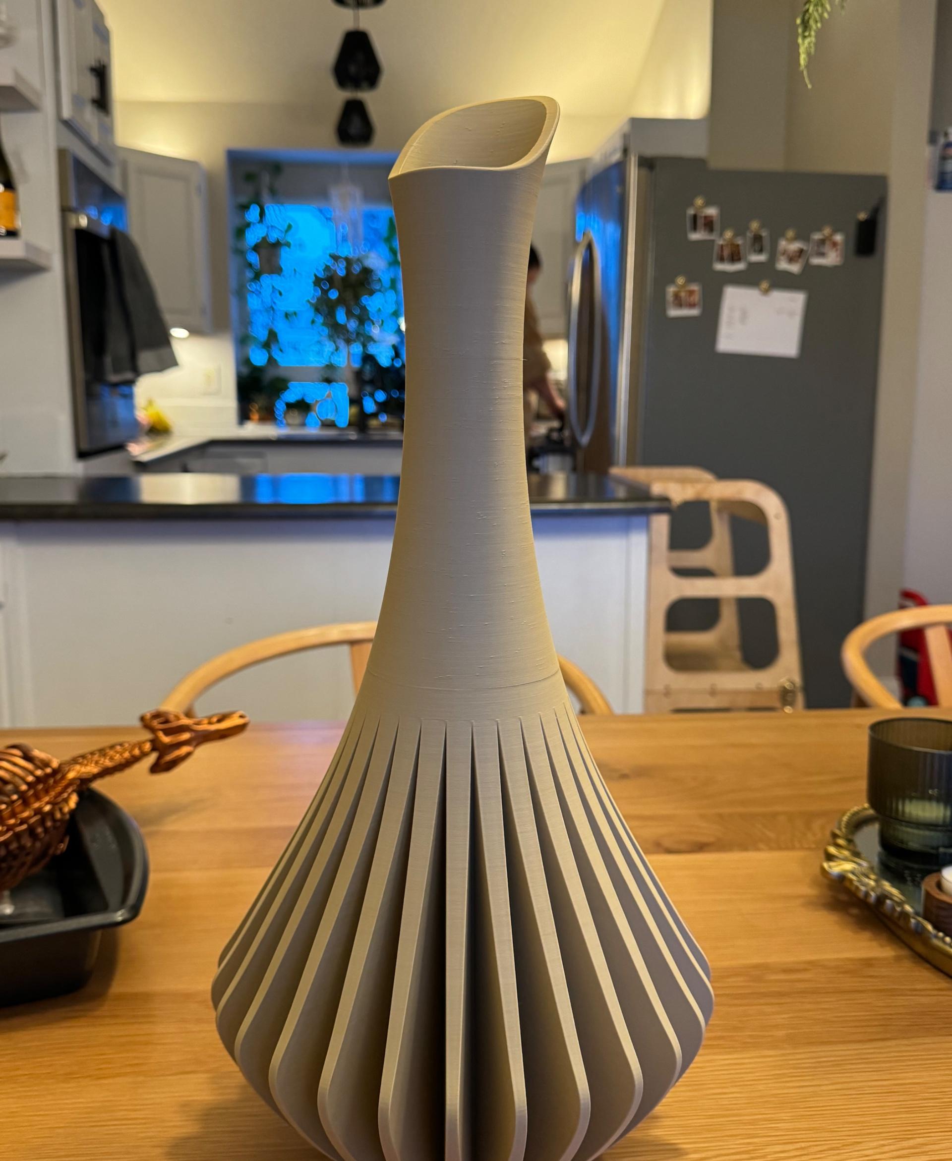 MCM Vase - Scaled it up and sliced it near the transition to the neck. Also added some pins to align it in orca slicer but they snapped off while I was fitting it together (filament was printed super dry). Printed with Bambu PLA matte desert tan on a P1S. Used adaptive cubic with 15% infill to save some filament and used just over 1kg.  - 3d model