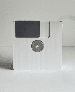 Floppy, tape dispenser with paper clips/push pins storage. 3d model