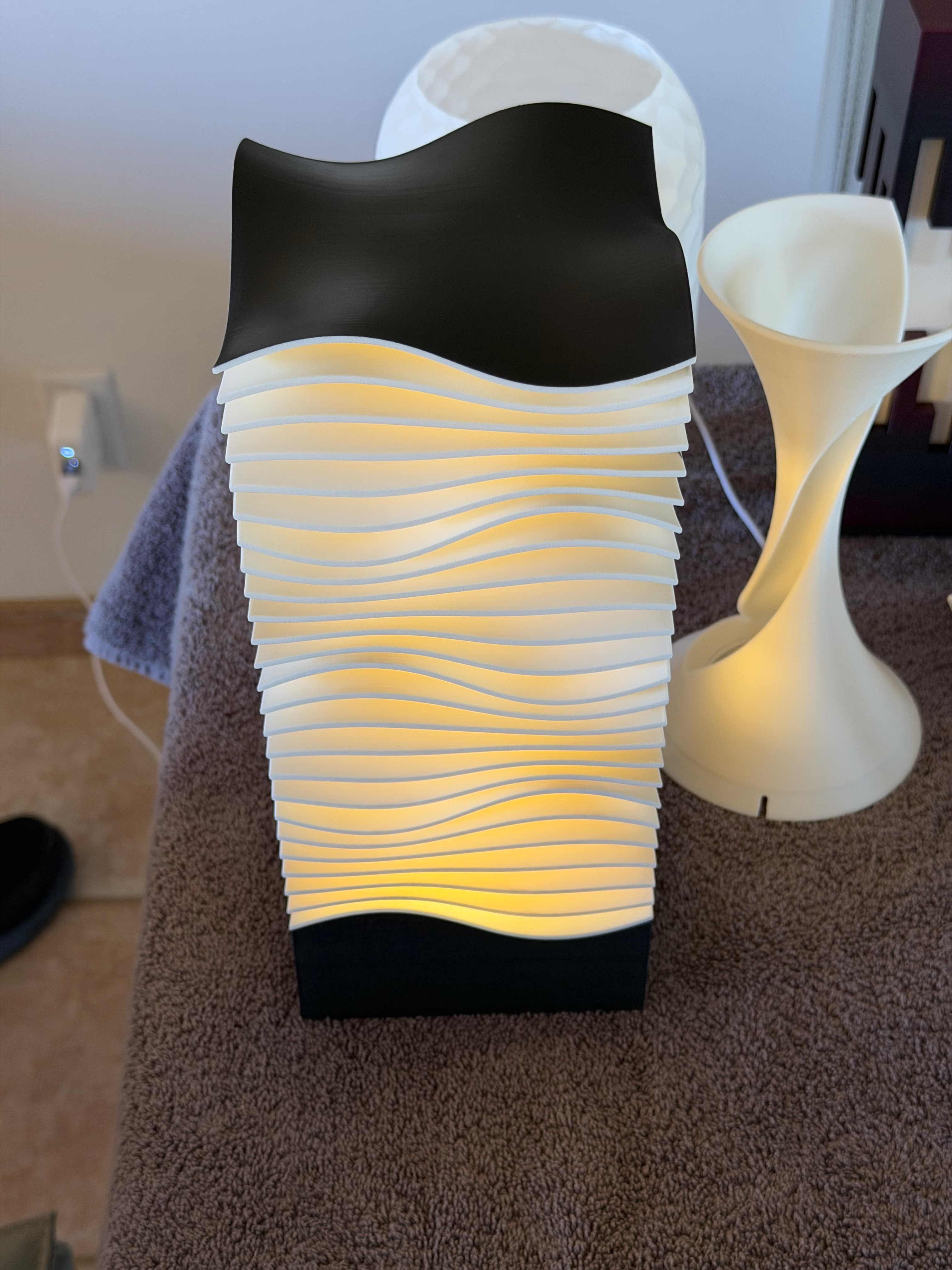 A great model, could be a fantastic one if you 1) Changed the square interior to cylindrical (to match the LED light) 2) Provide a way to change the filament on the top (to avoid spray painting) to the square doesn't show up at the top..