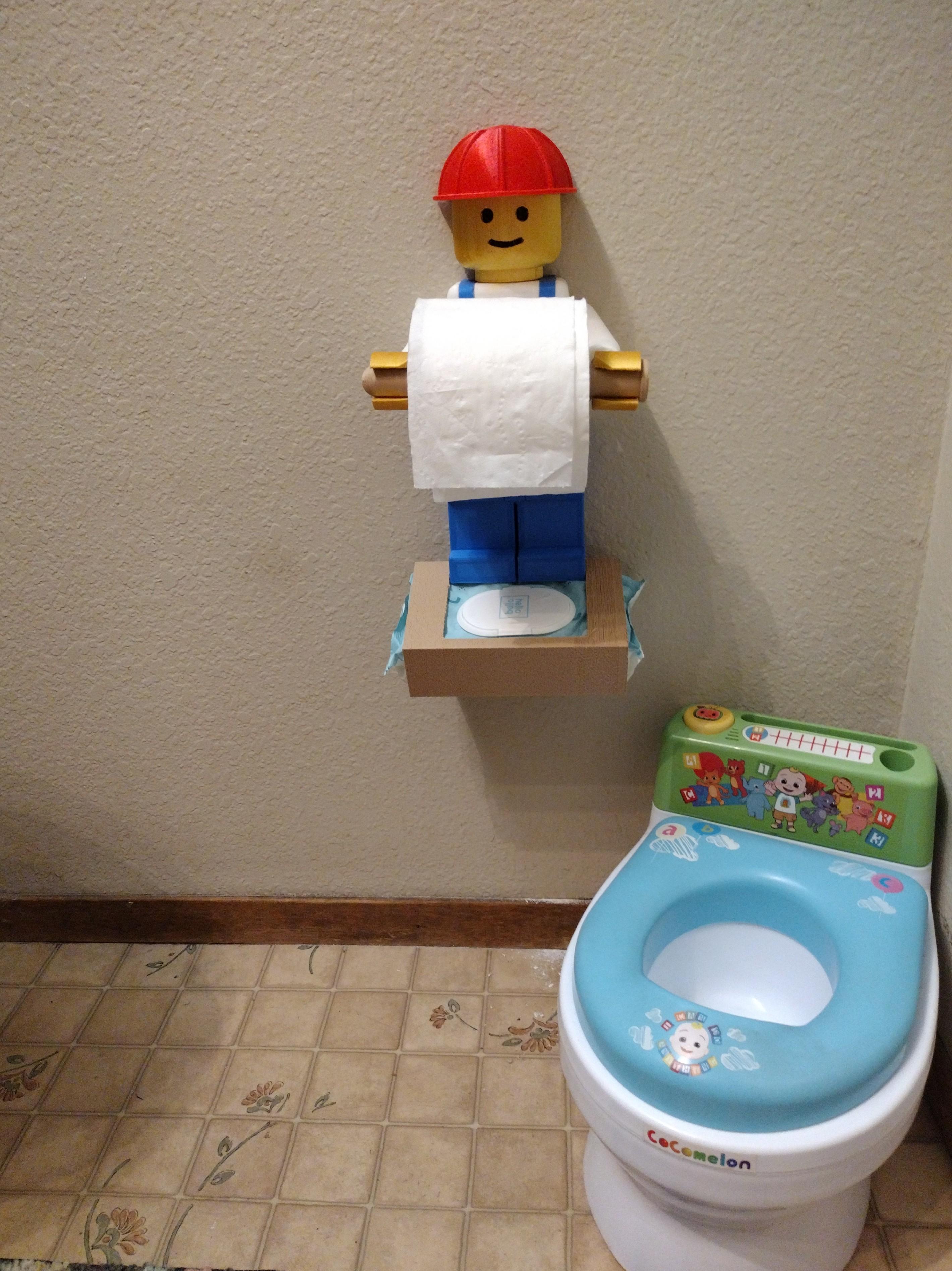 LEGO Toilet paper holder - My Great Granddaughter had to have a place for her "Wet wipes", so I added a fixture to slip in a standard pkg of wet wipes at the bottom.
She "Loves it". - 3d model