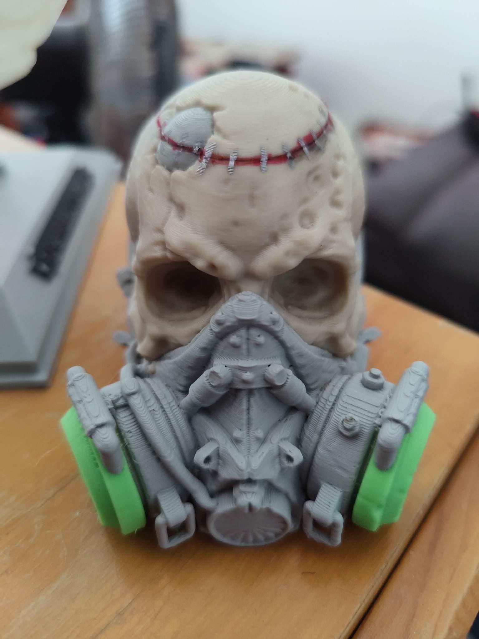 Masked Skull  - I put him into bambu studio and painted this model. Printed with Esun bone white , lime green and light grey. Had a power outage with about 40 minutes to go. I took the model off the bed b4 i realised i could have resumed the print. So i printed the top bit and glued it on and think it makes the model. Limited support was used and realise i could have used more. Printed on Bambu X1 Carbon with AMS. Printed at bambu standard 0.2 LH.  - 3d model