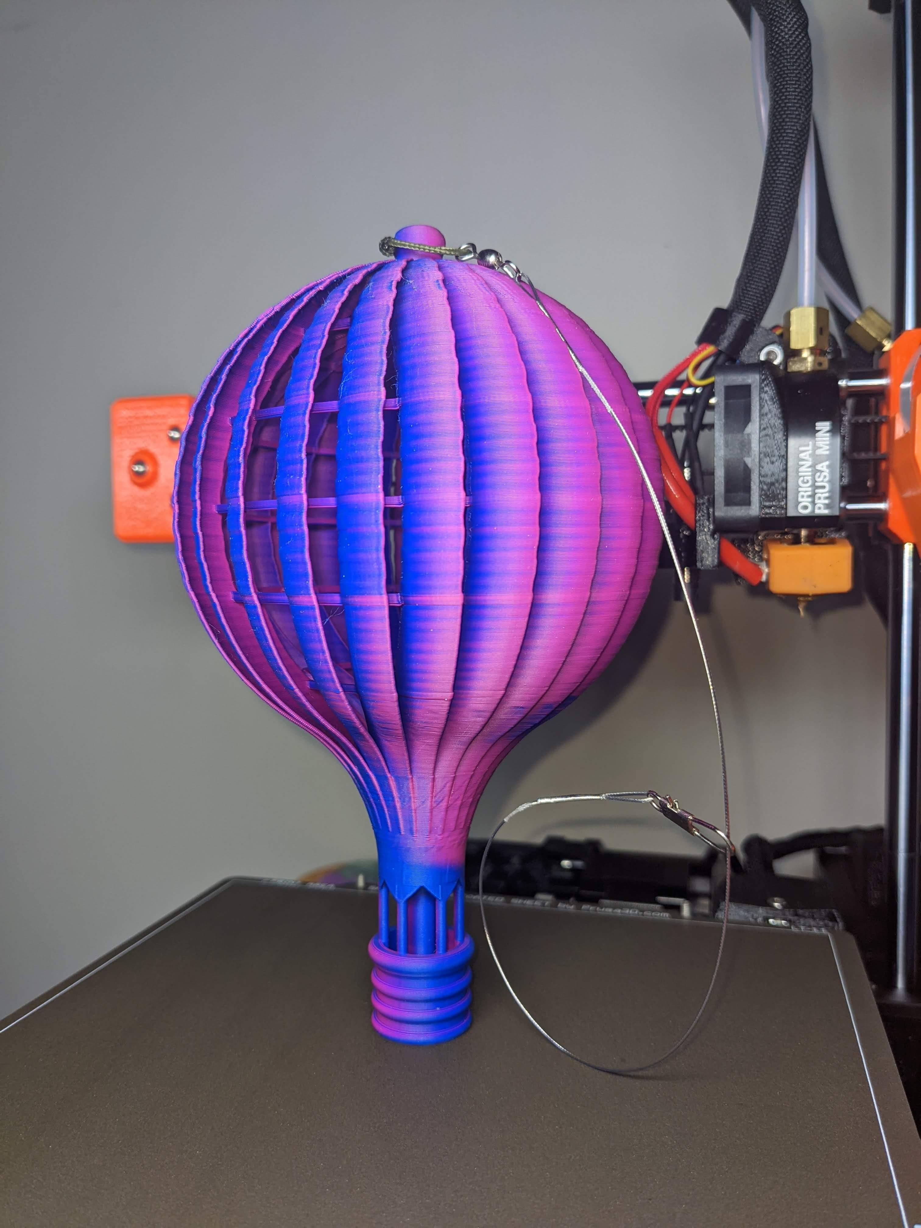 Wind Spinner Balloon - Had some interesting expansion/contraction along the fins creating a serrated edge, but the print turned out so good, I'm gifting it for a B-Day. Made @ 75% on the Prusa Mini+ with Eryone Matte Dual Color Blue/Pink. - 3d model
