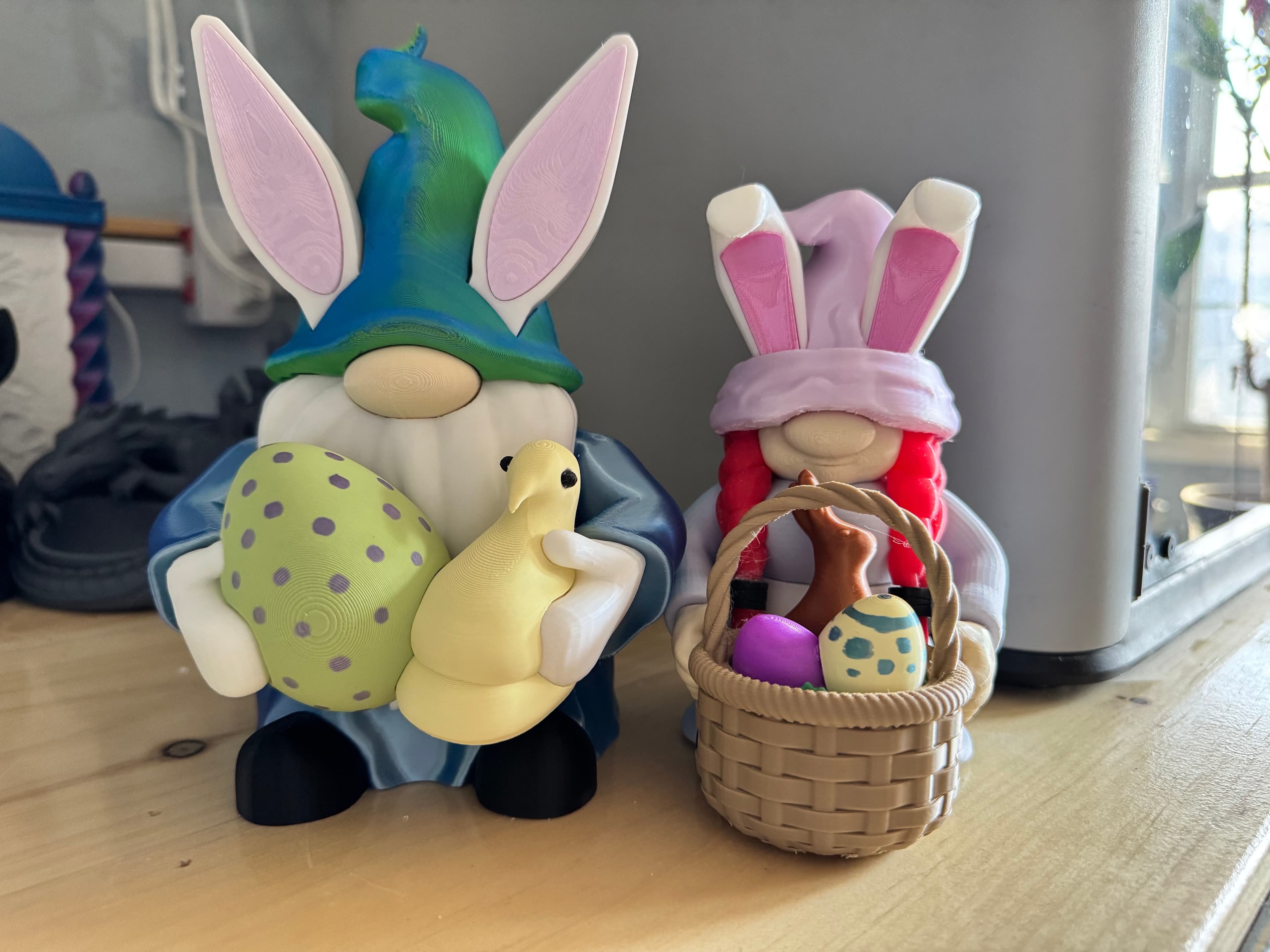 I only took a picture of both the boy and girl gnome for Easter, but it shows the difference in size. I had a heck of a time with the hands and removing and inserting them with the objects. I ended up having to print the hands twice due to them breaking regardless of how easy I tried to be on it. I learned my lesson and filed down the outside of the rectangular insert the second time through. They turned out adorable though!! Love them!!