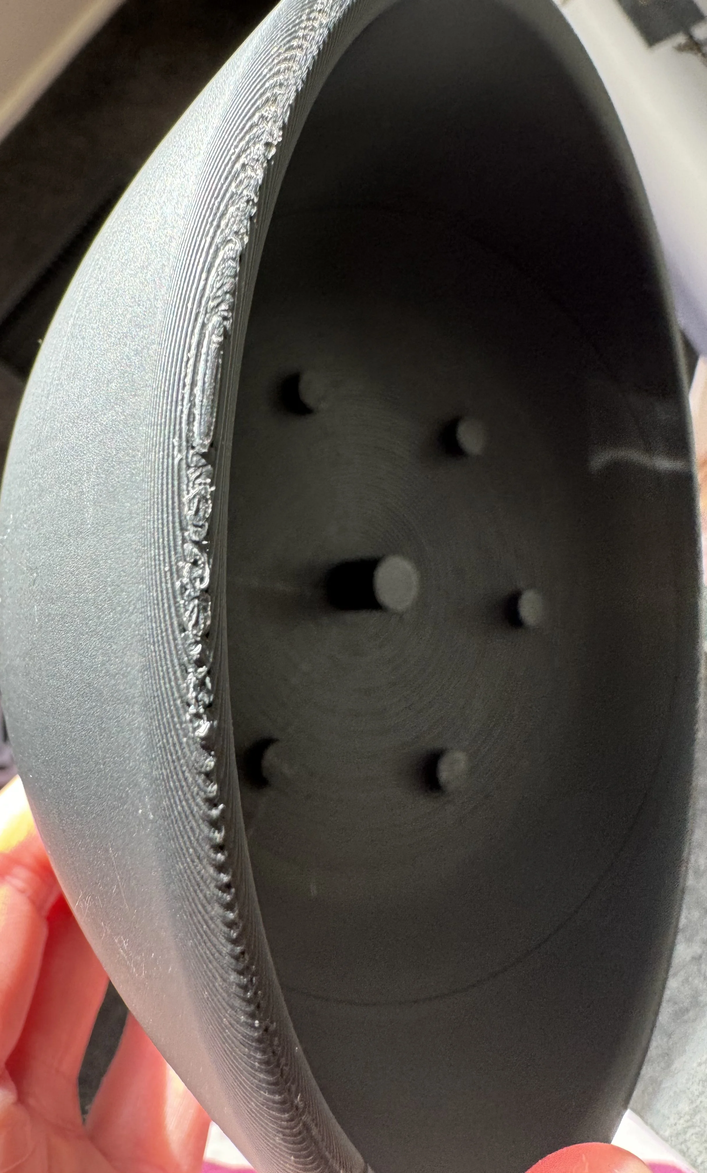 Why would this base print like this? the top and bottom edges/lip of the base piece have gone all messy and rough whereas the rest of it is smooth.