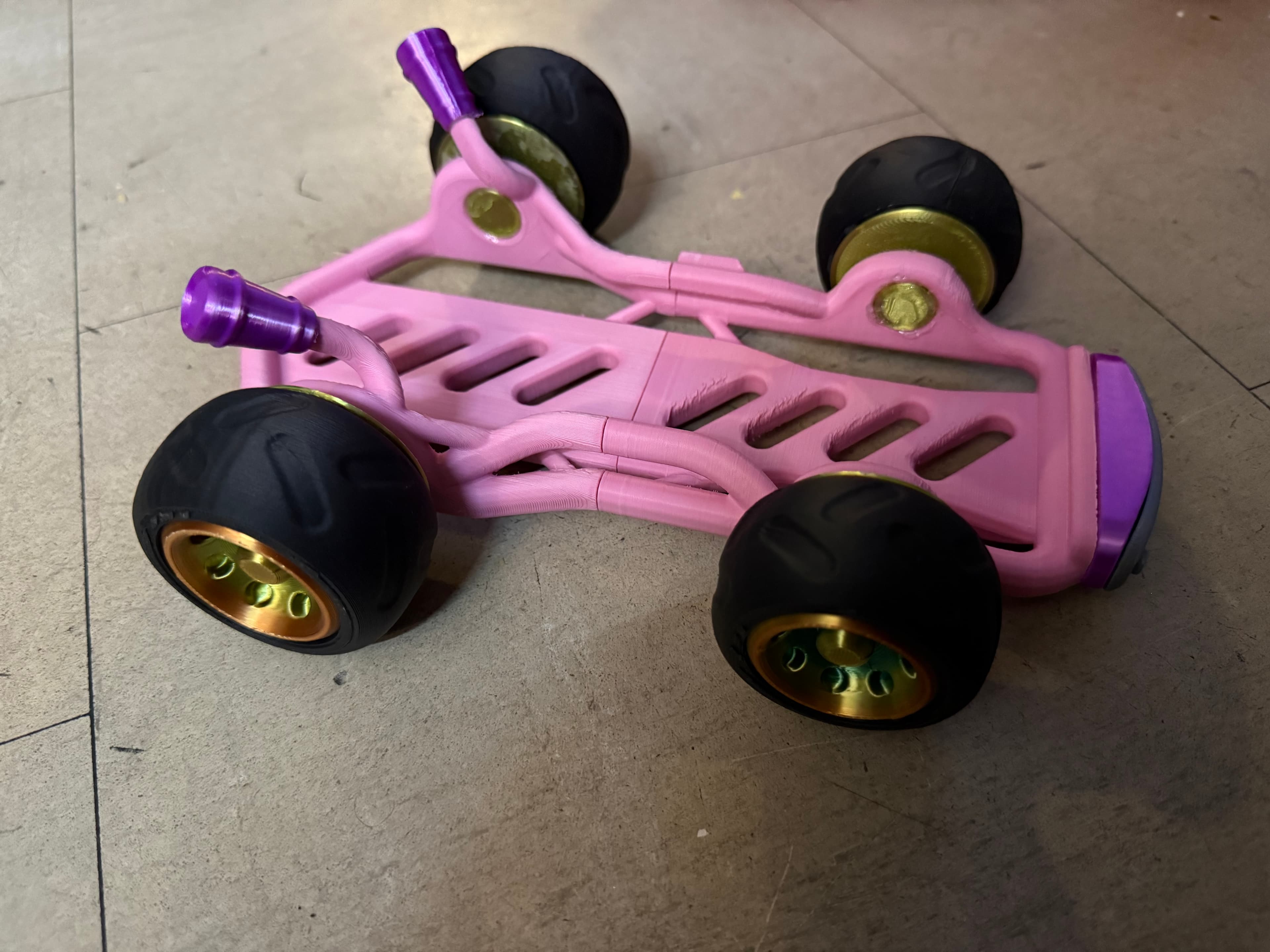 Ok so I did peach inspired go kart. Going to do another 2 sets of different people. First part of the kart messed up but that’s on me. I think my filament is kinda poo, but I’ll manage. It’ll be better next time around. But overall this is a good tester to do. I did rainbow rims for her kart. But it’s nice. This is the OLED version.