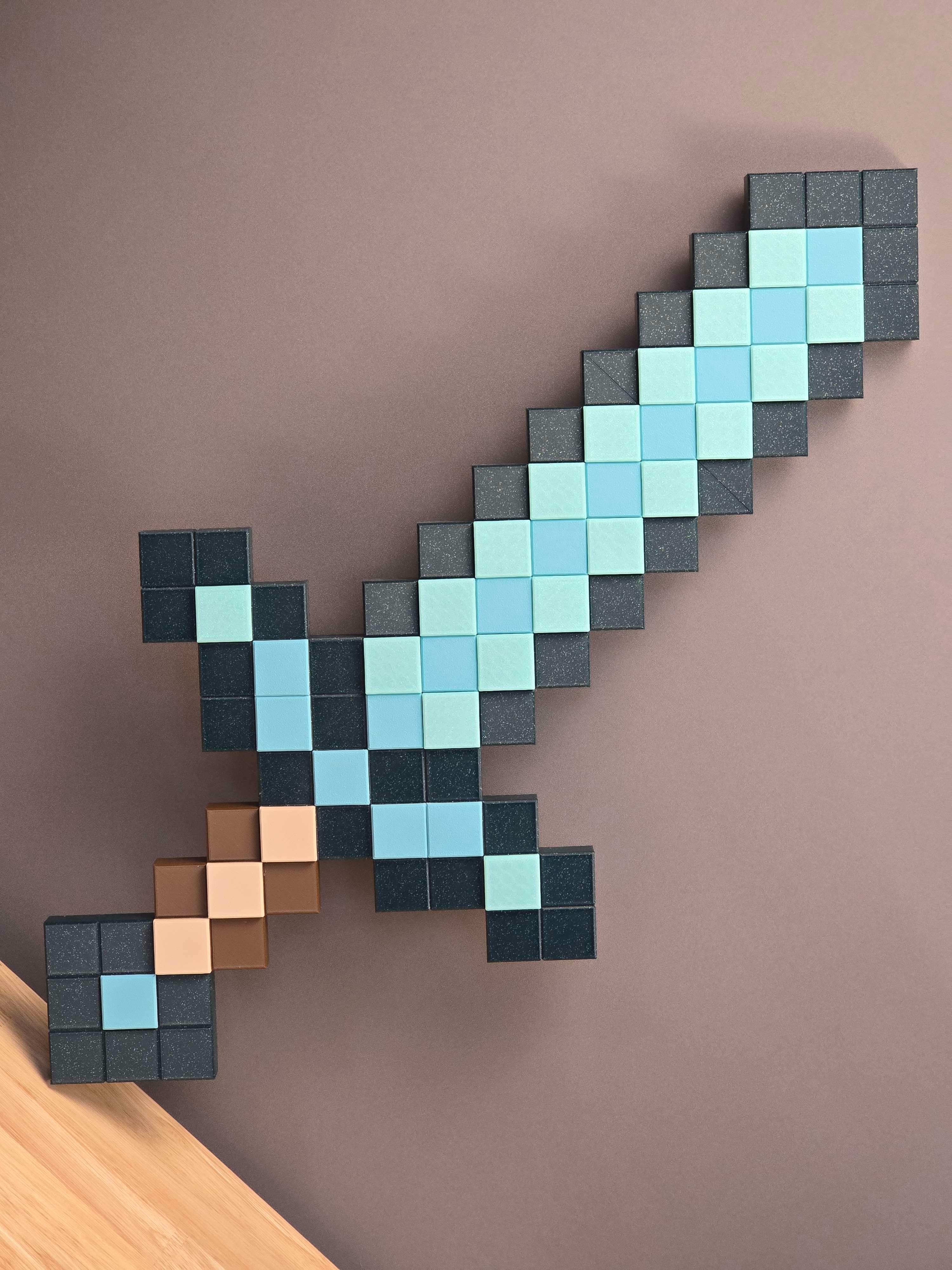 Used colors to match the actual pixel art of a non-enchanted Minecraft sword!
Polymaker Galaxy Dark Green, Celestial Green, and Teal PLA
