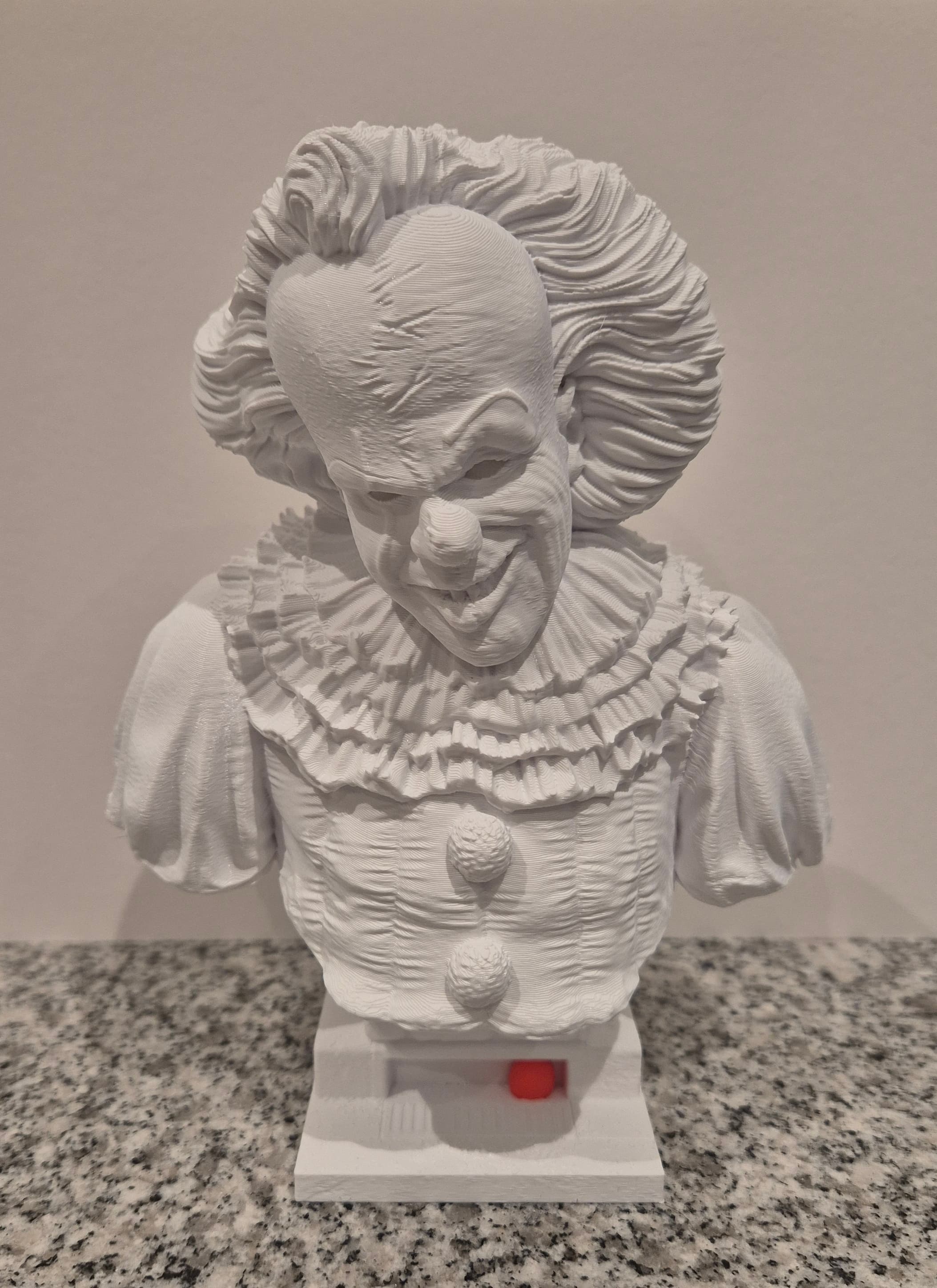 Excellent design (as always). Added red/orange illuminescent eyes with glow-in-the-dark PLA from Eryone, and a pink balloon with PLA+ from eSun.
Very happy with the result.