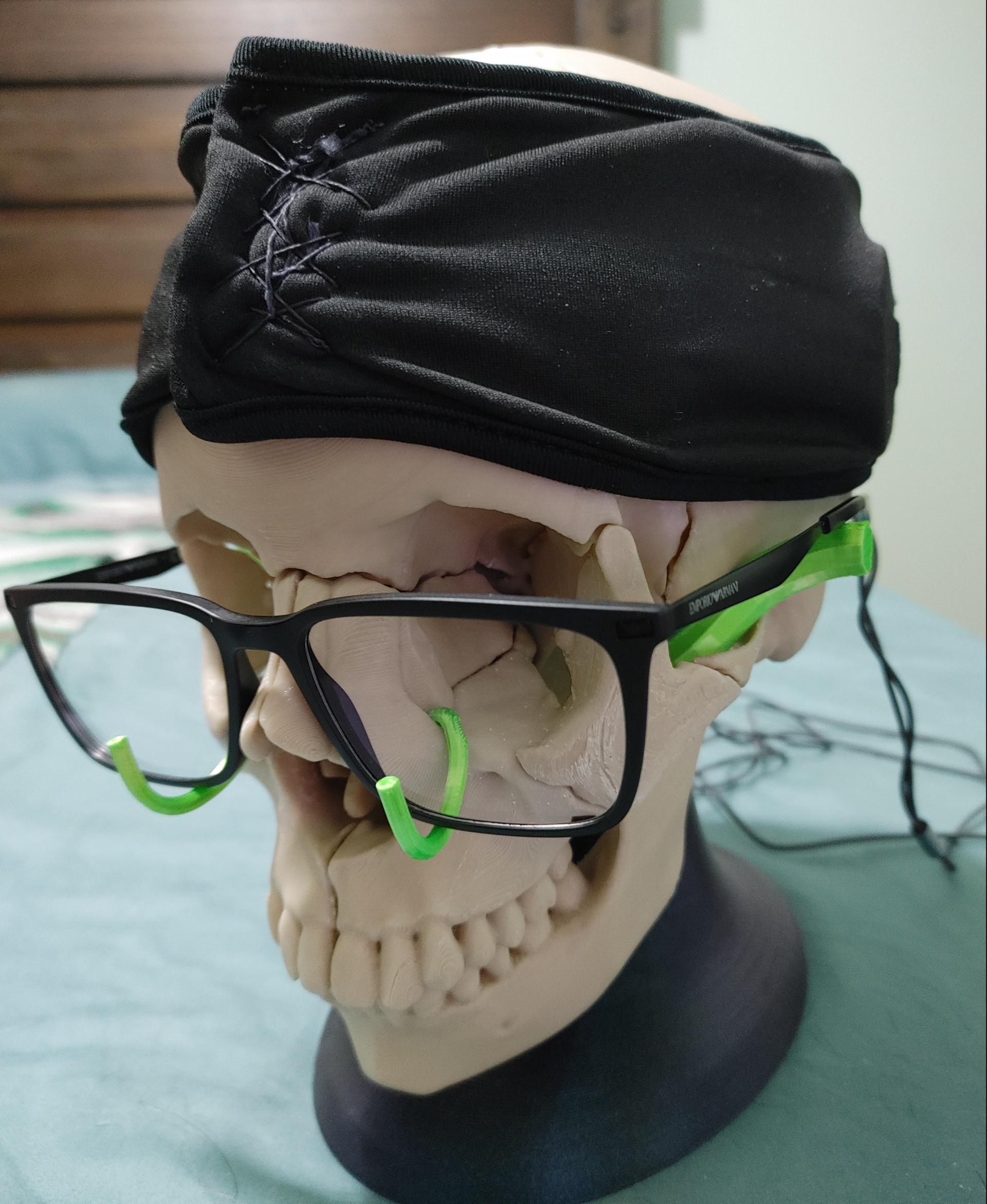 Full Size Anatomically-Correct 18-Piece Magnetic Human Skull Model - Skull was made in eSUN PLA+ Bone White at 0.2mm layer height and 15% infill. I added my own glasses holders in the lime green.

To answers the questions in my other comment:
1. YES. The magnets feel plenty strong for the headband and even for shaking the skull somewhat hard. I didn't print this solid, so it's still pretty light weight, but heavier prints would likely still hold as the recommended magnets at N52 are really strong.

2. Clearly yes as you can see in the image. The gap between the pterygoid plate and foramen magnum the stand goes through is plenty big. - 3d model