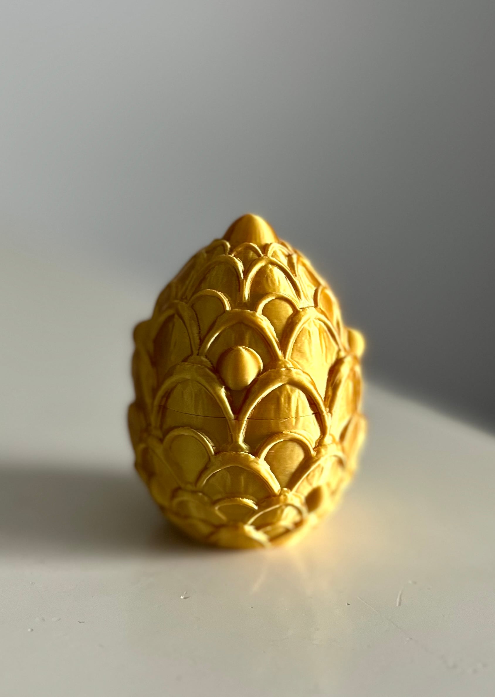 My kids and I absolutely love making these dragon eggs - I’m genuinely not sure who likes them more! We’ve done a lot of scaled down sizes since even at 60% the eggs are pretty large! The largest egg in the photos is a 50% scale and fits the baby dragons nicely. Once we jumped from 60 to 50 though we saw the locking threads get loose. So the 60% egg still has that satisfying click into place but the smaller scales lost that click. We wanted to do a lot of the smaller eggs for Easter so I tinkered with some settings until we came to a solution. In Bambu studios the setting is under quality, called XY hole compensation - I know other slicers have a similar function just called something different. I applied the setting to the top half of the egg to make the hole on the interior slightly smaller to fit more snugly on the bottom half, and it’s a very minute adjustment! I settled on -0.2mm on a 35% scaled egg and it’s now a perfect fit. Another printer might have slightly different tolerances so the number may change slightly but I just wanted to share it is possible to make these eggs lock nicely even at very small scales! We’ve even gone down to 30% successfully and they make the cutest homes for those tiny wyverns and other little critters kids love!