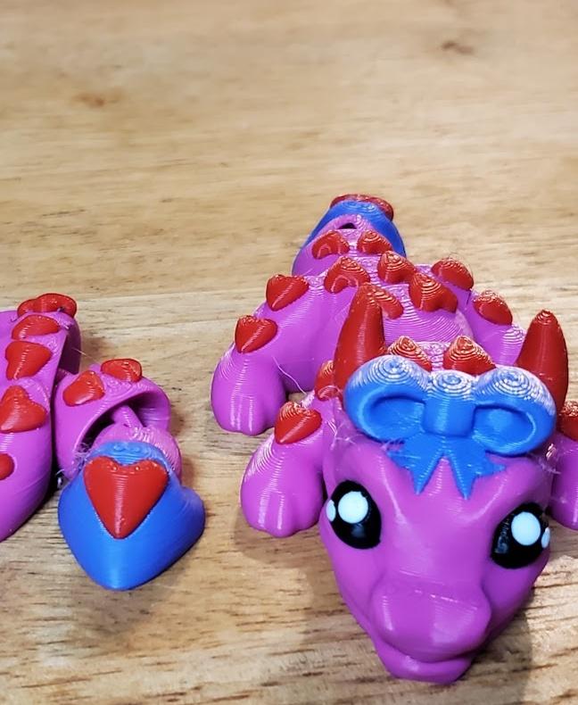 Val, Baby Love Dragon - Articulated Dragon Snap-Flex Fidget (Medium Tightness Joints) - Printed on X1C with Bambu Basic Magenta, red, black, white and purple. Purple looks kinda blue in the pic.
Came out great! Thanks for this! - 3d model