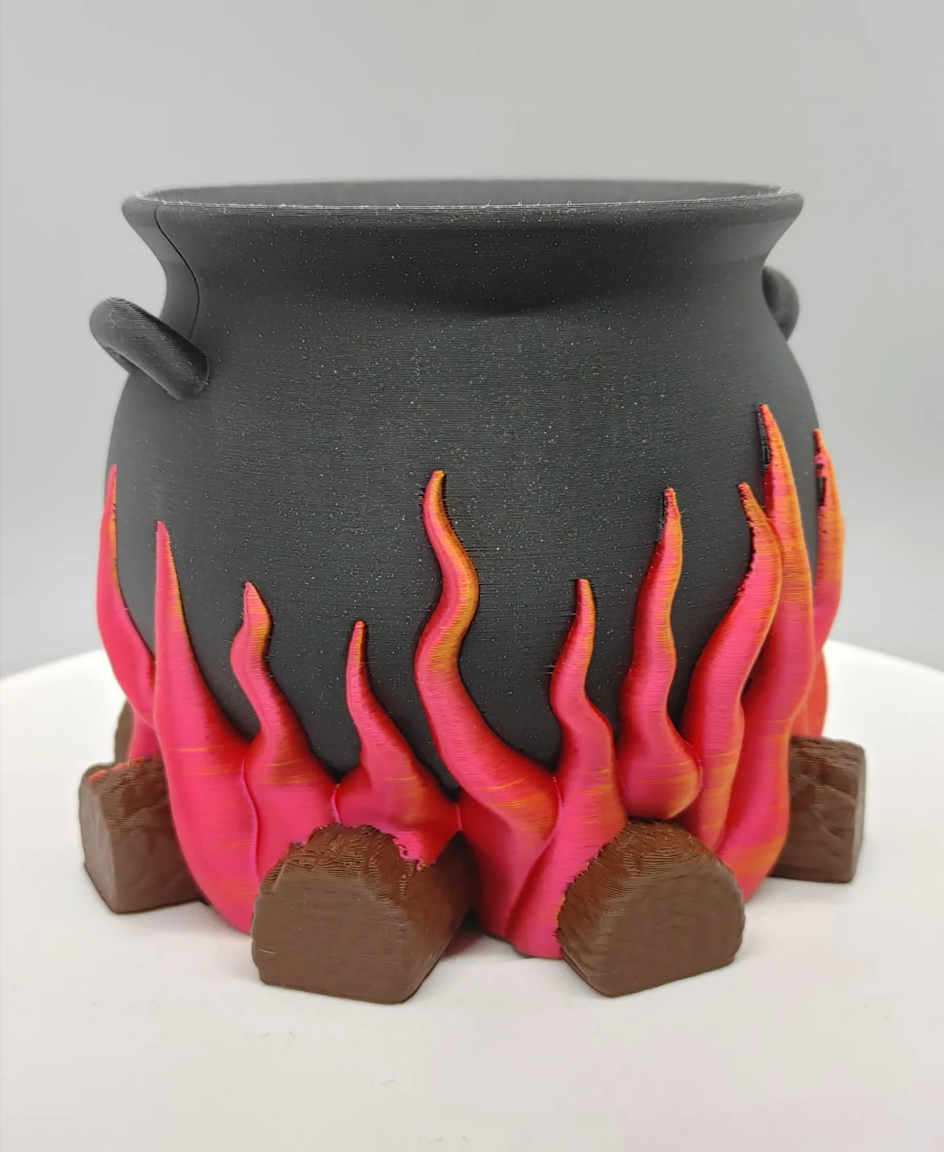 Love how this turned out! Such a great model. Printed in Printed Solid Soul Black Glitter & Tree Brown PLA and Eryone Dual Color Red & Gold Silk PLA on the Bambu X-1 Carbon using the AMS.