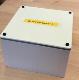 I scaled up this design in my slicer to 120x120x70 mm and increased the thickness of the TPU gasket to 3 mm.
It perfectly fits 4 canisters of Slice Engineering's activated alumina desiccant for long-term storage after recharging in the oven as directed for 2 hours. 3d model