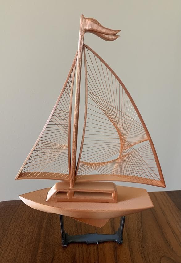This was awesome to print, thank you! This is a copper-colored filament and the sail strings glisten in the light.