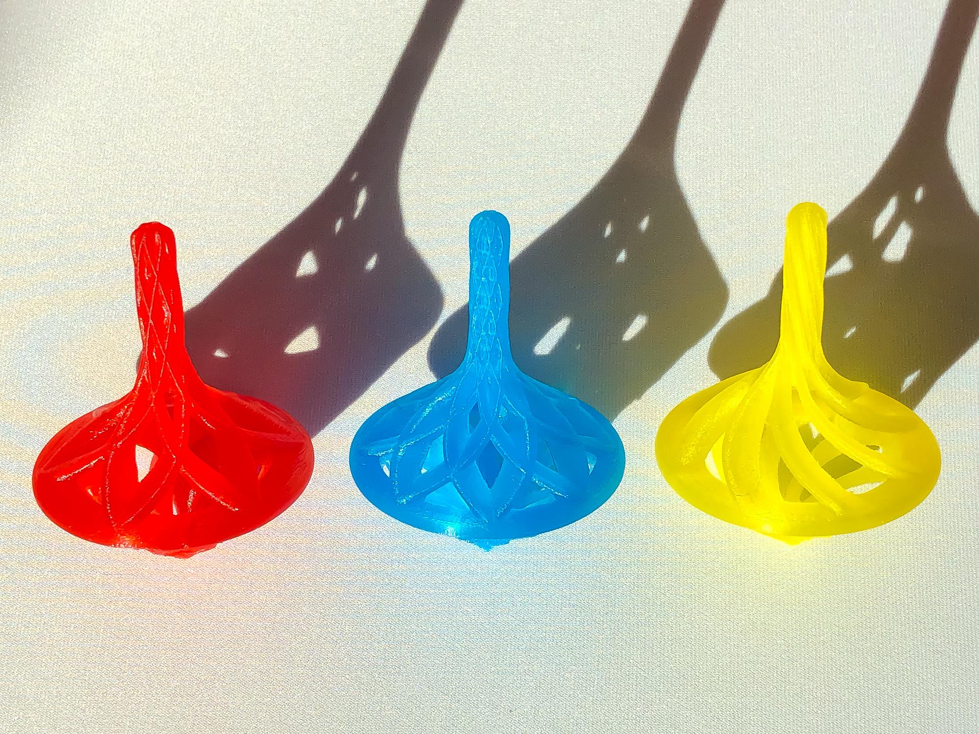 Set of 3 Spinning Tops - All 3 designs printed with Hatchbox colored transparent PLA. - 3d model
