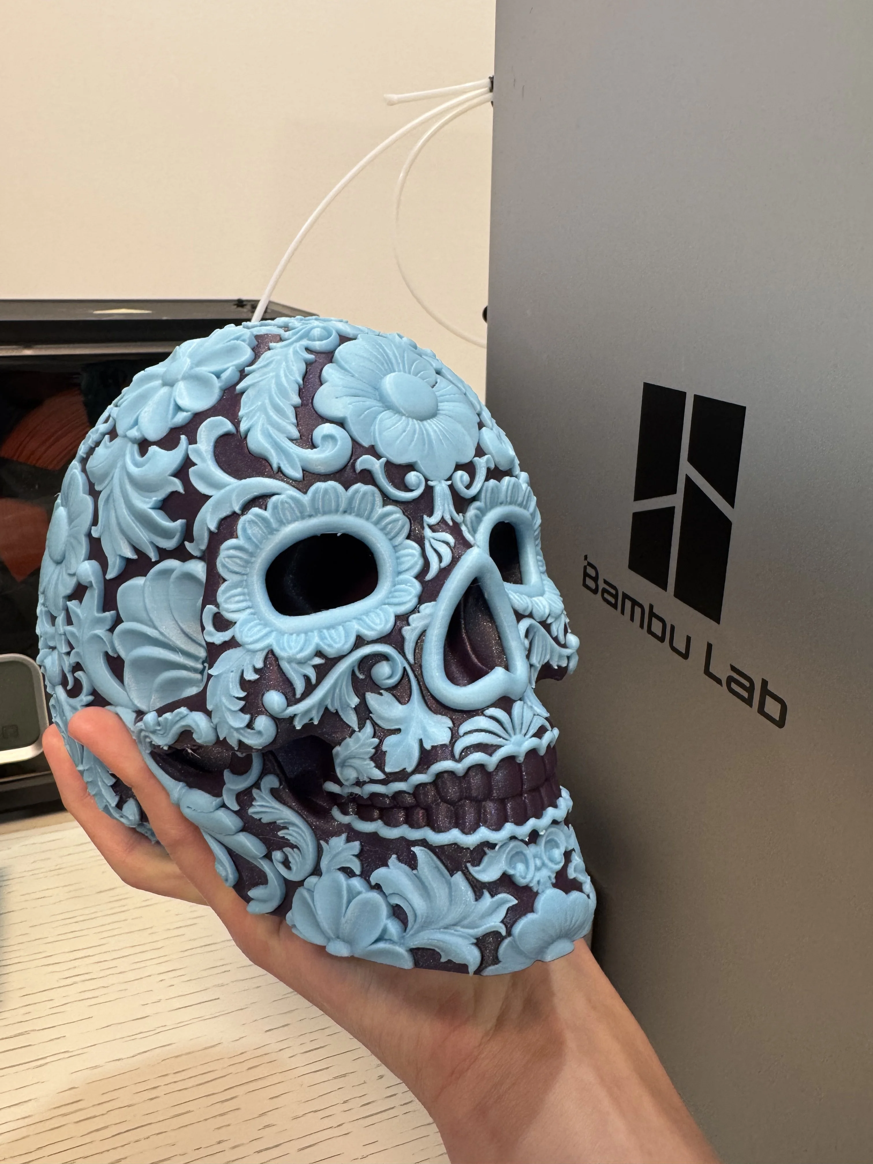 Gorgeous model; it will make a great gift! I used Bambu Purple PLA Galaxy as the base with Bambu Glow PLA for the floral decor.
Note to those attempting multicolor prints of this skull (depending on the colors used): lowering the purge multiplier (1 to 0.75) and purging into infill significantly reduced the time and waste of this print since the skull is not hollow and uses a lot of infill.