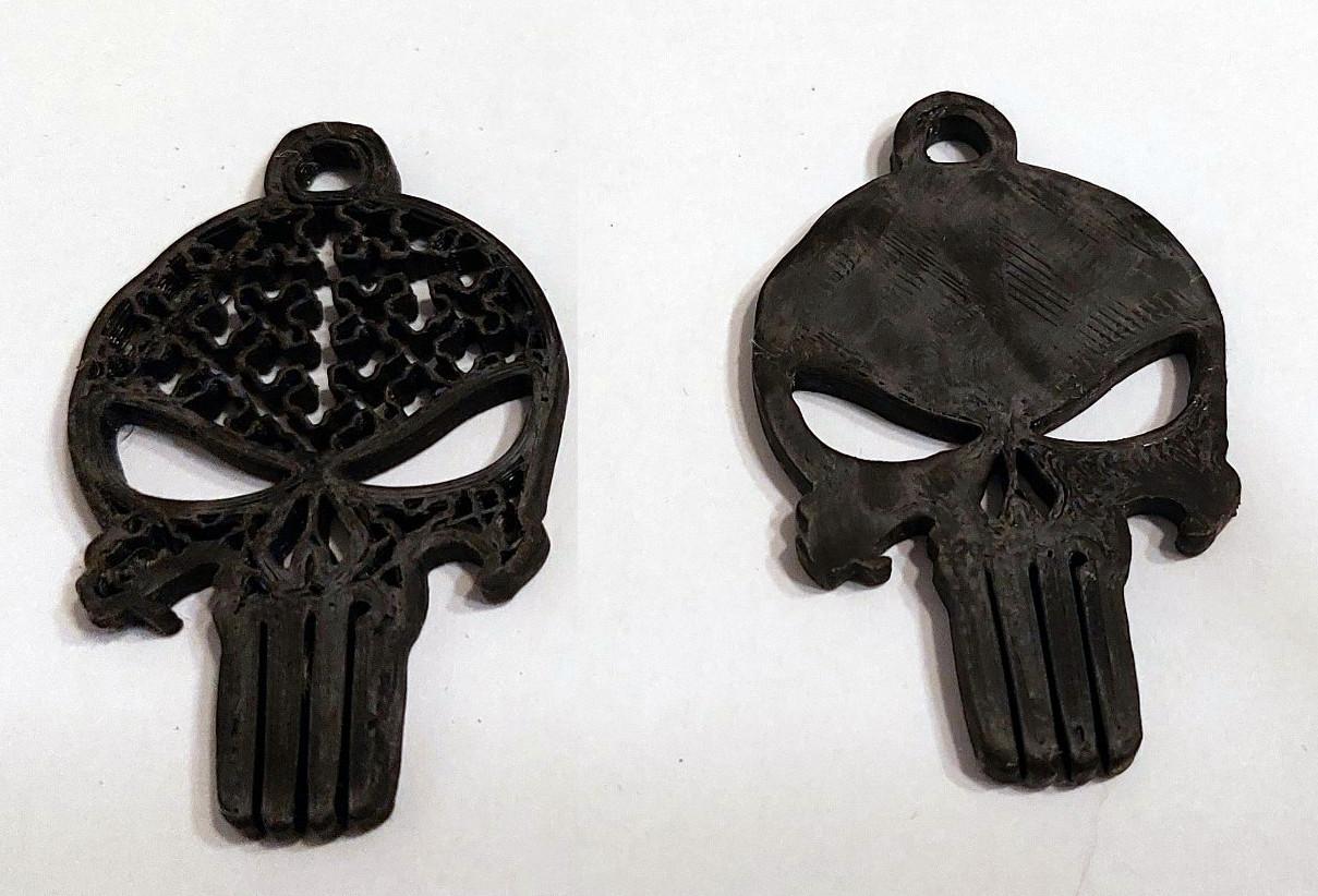 Punisher Keychain.stl - The one on the left was printed without top / bottom layers and cross infill.

 - 3d model