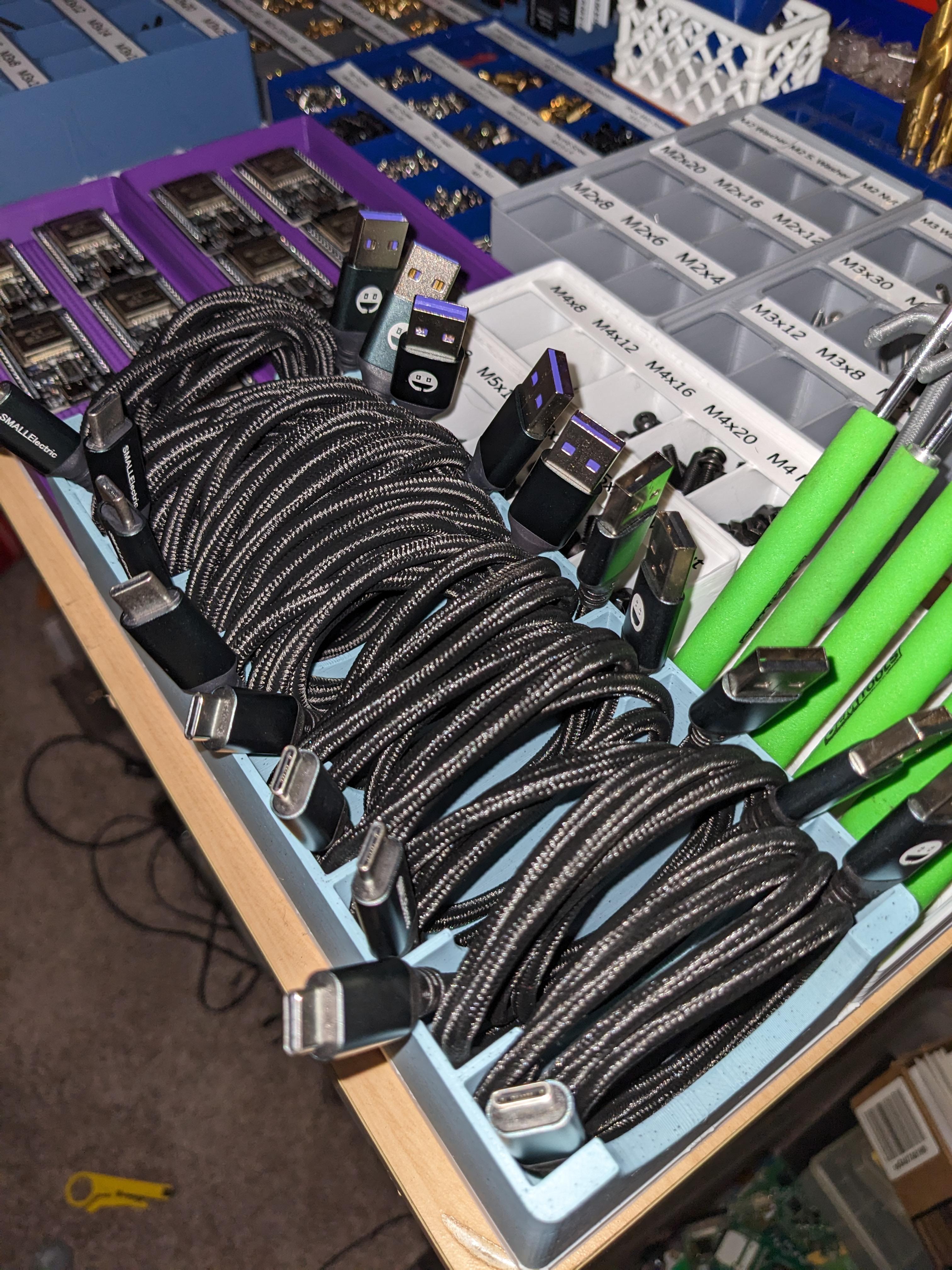 USB Cable organizer storage bin - Gridfinity - Works great! Versions with wider slots may be nice for larger cables, but this fits these 6' USB C cables in without too much issue, just a bit tight. - 3d model