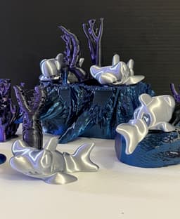 Hammerhead printed in silk filament. The rocks, plants etc are from a failed print…Supports etc.
These little sharks also make good chopstick holder lol. 3d model