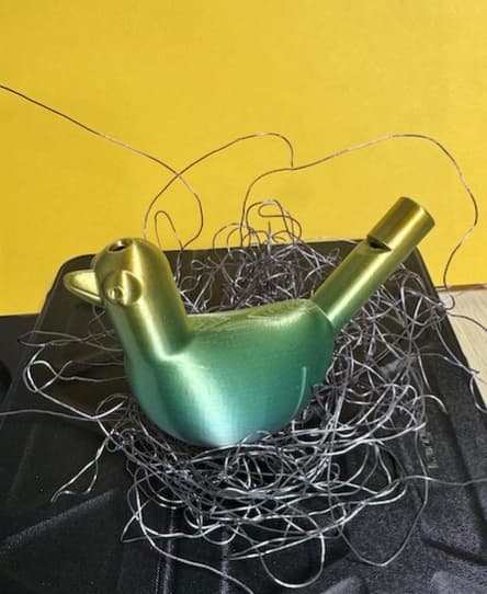 Printed on a Bambu P1S using TTYT3D `Silk Shiny Fast Color Gradient Change` PLA
- I added a brim when slicing. The first attempt made a nice nest though :-)