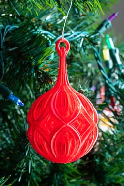 Diamond Christmas Ball - Matterhackers Translucent Red PLA lit by the morning sun. - 3d model