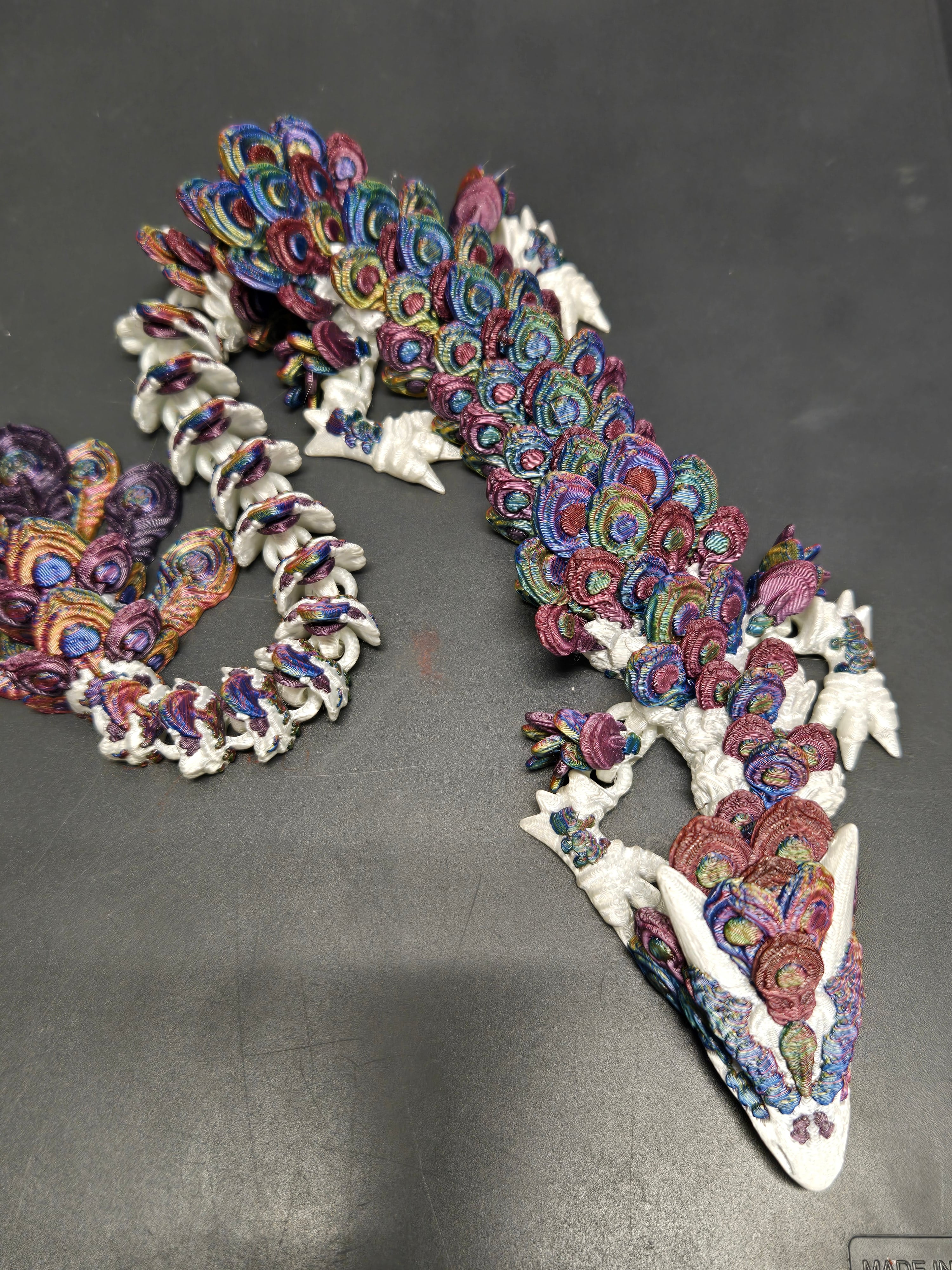 I used three different tri colored PLA silk filaments to create more of a variation in the peacock feathers.