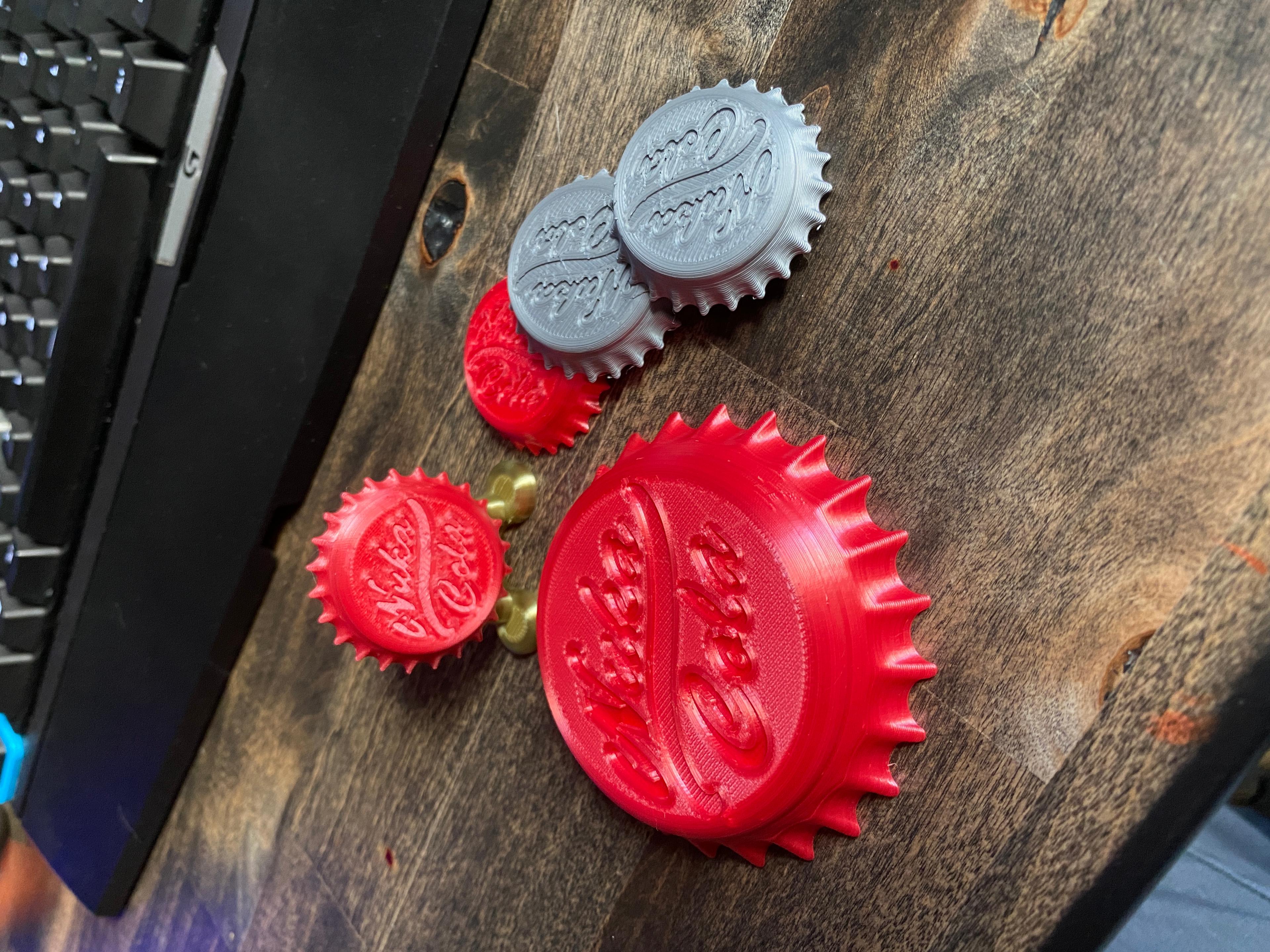 Nuka Cola Bottle Cap + Display Stand - Fallout Halloween Accessory - Nuka Cola Bottle Caps (large one is a 200% print)  - 3d model