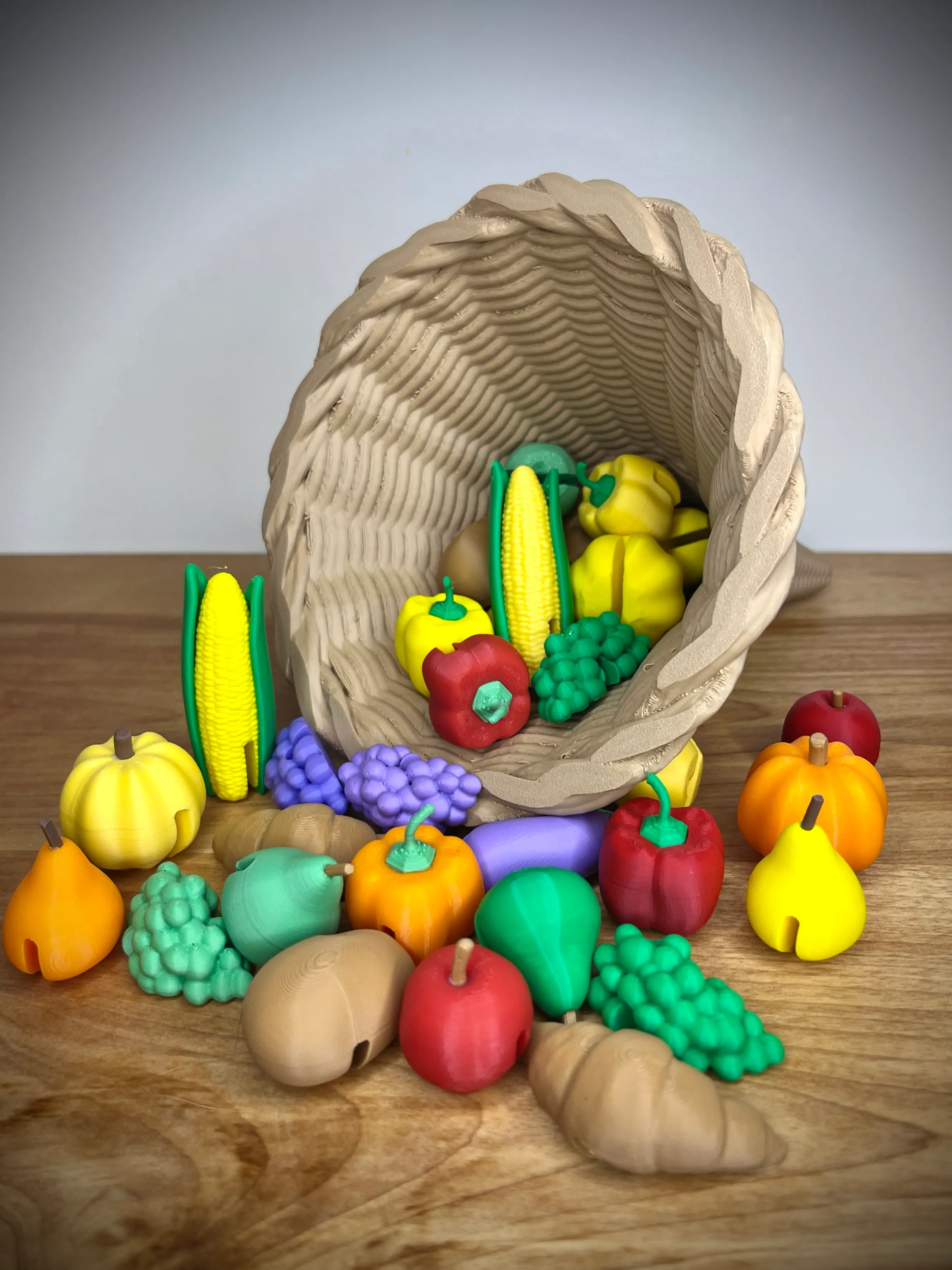 I'm ready for Thanksgiving! The mini fruits and vegetables were the most fun to print. I scaled the cornucopia to 125% so I could add more mini foods. We'll have 24 people over so I needed more room. Stems fit perfectly. Very high quality model.