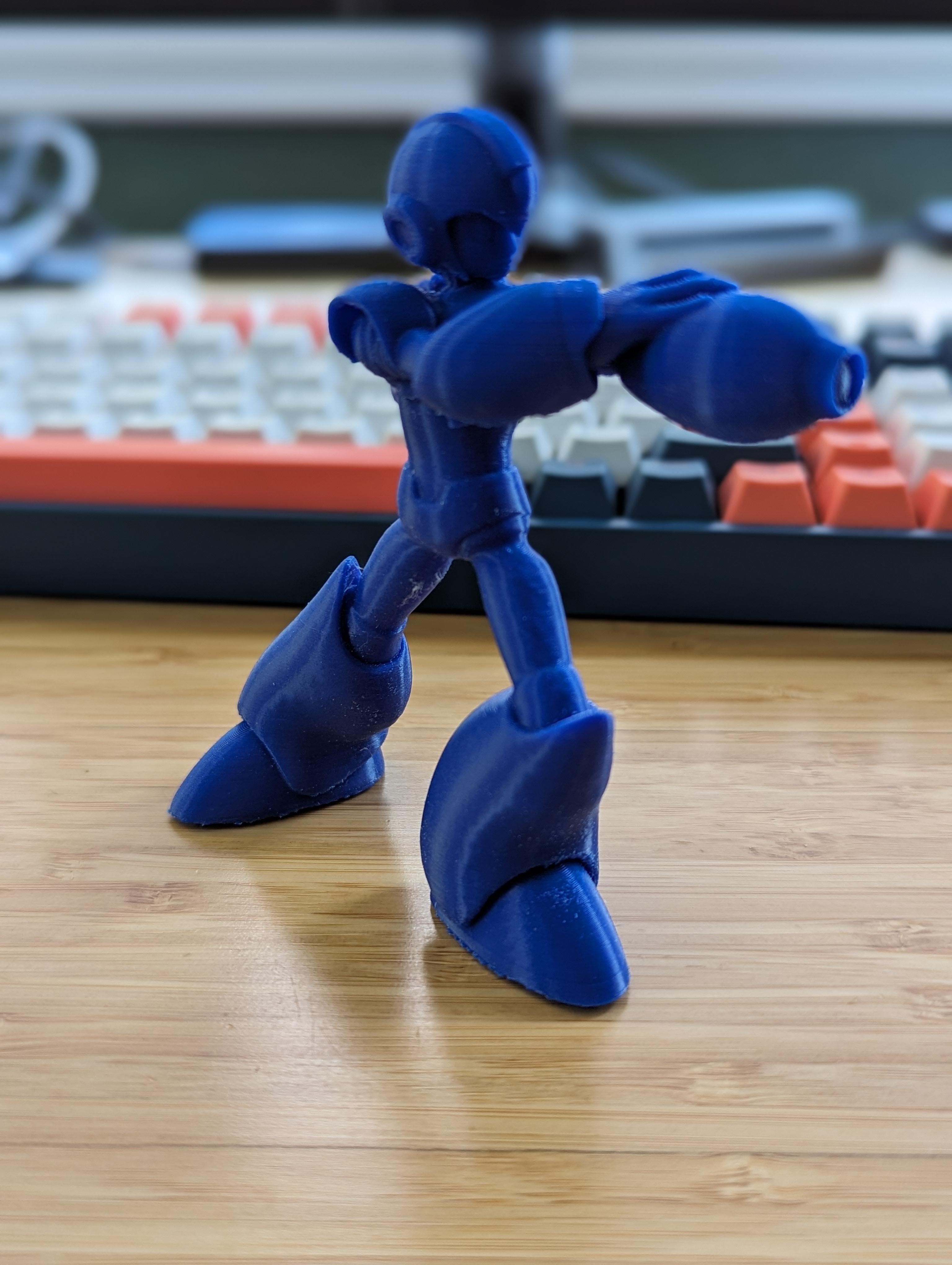 Megaman Blaster Stance - Pretty cool model.  Printed on an Ender3 V2 Neo, Prusaslicer with organic supports, Hatchbox blue PLA.  The one gripe I have with the model is that the feet aren't flat, and I wasn't paying attention when I set up the supports and ended up with a lot of random support material on the bottom of the feet.  This was challenging to remove and I ultimately ended up using a dremel to sand them down.  All in all though, this is one of the more printable models of X that I have seen available and I highly recommend it! - 3d model