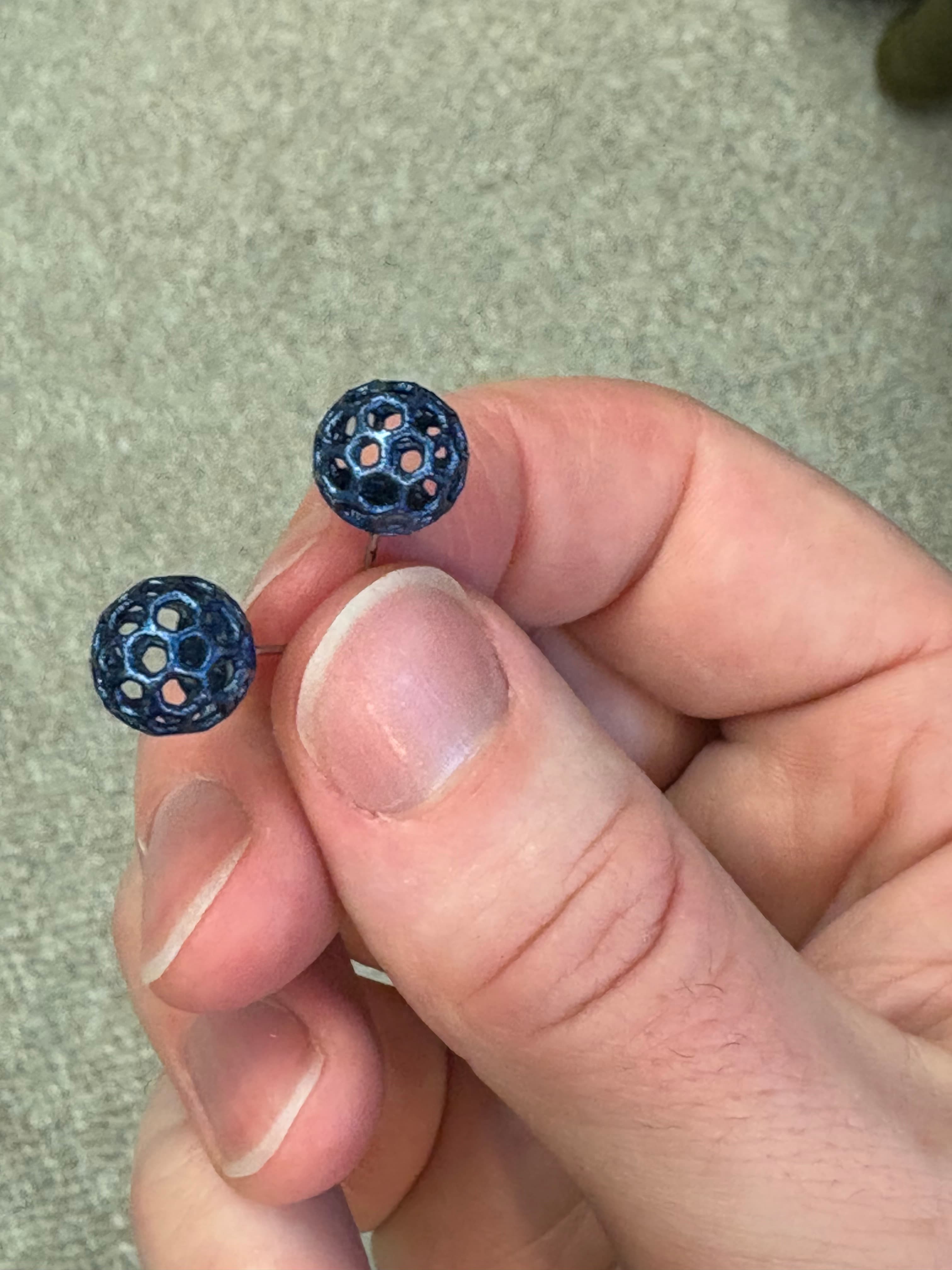 These turned out great! I would recommend turning them with the earring base toward the build plate to reduce divots from the support interface being visible on the surface of the sphere.