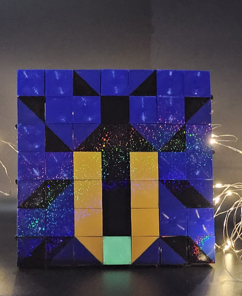 A firefly with an archimedean chord spiraling sky and glow-in-the dark tile for its bioluminescent light. All printed on a dazzling PEY build plate.