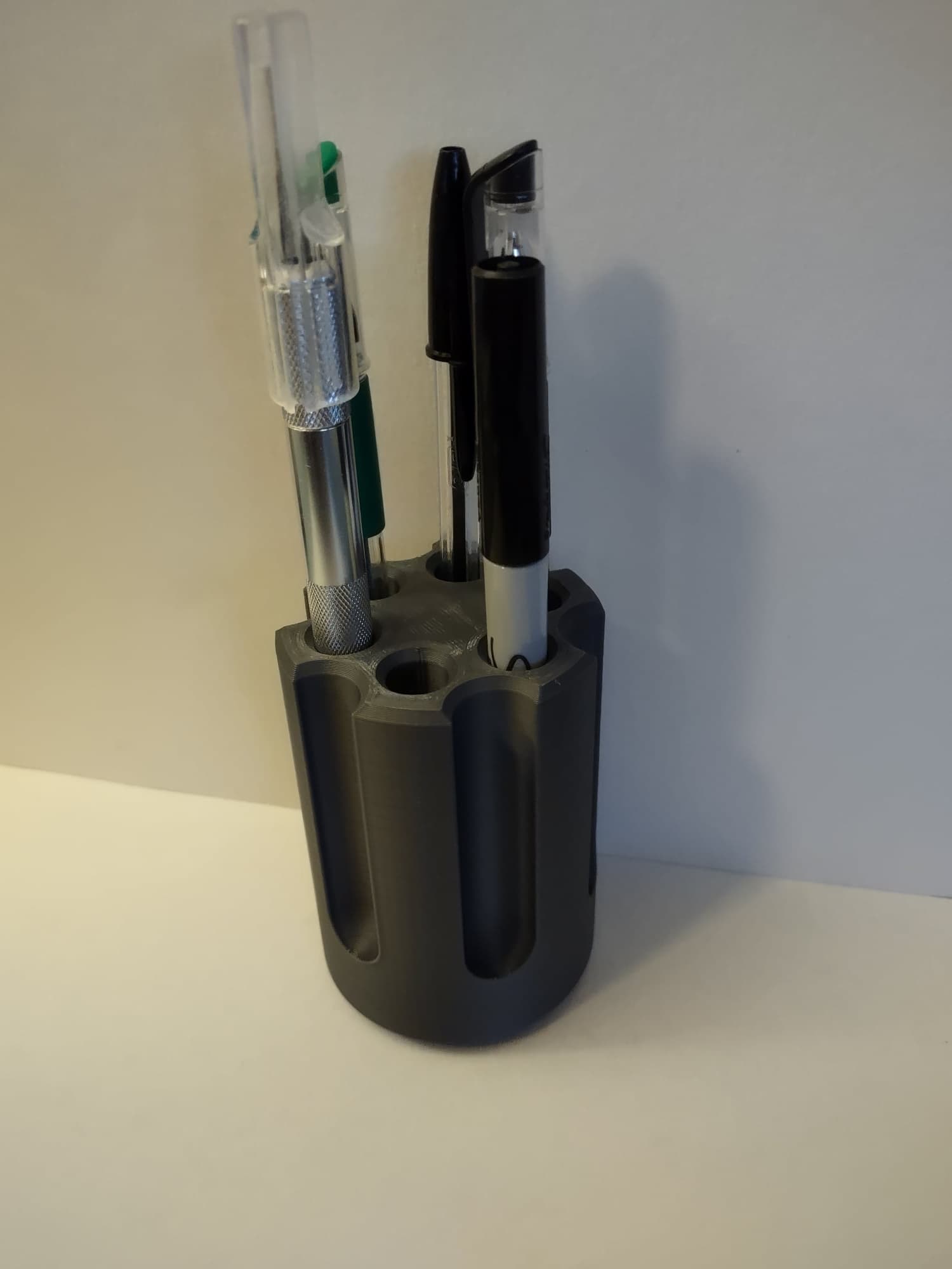 revolver cylinder pen holder with a twist 3d model