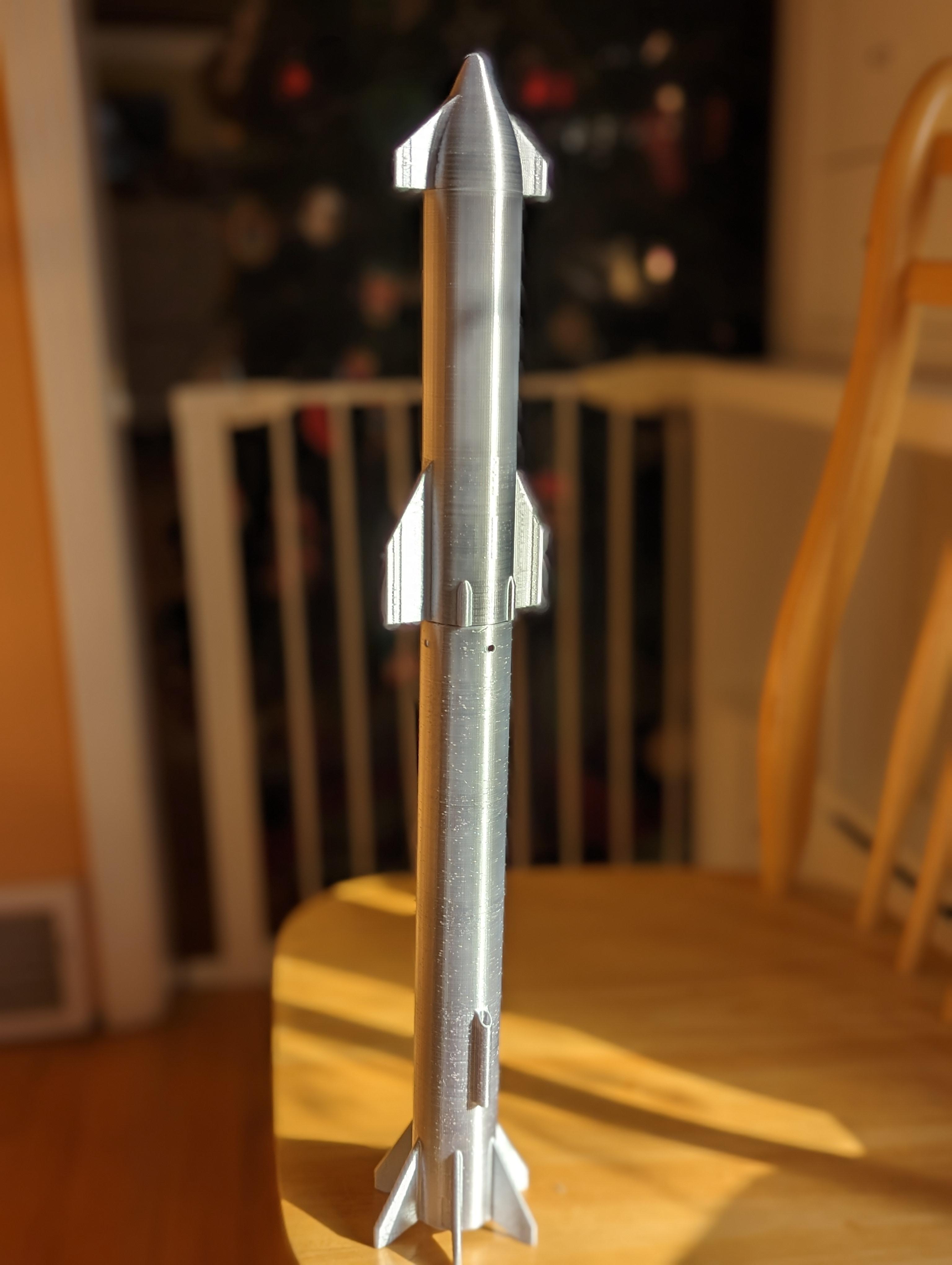 Starship Model Rocket with Heavy Booster Stage - Thanks for the model. It will make a beautiful gift. I can't wait to see it fly. Any tips on parachute size? Should I fold it into the main tube in the booster with wadding as usual?  What are the holes at the top of the booster intended for? Blowout prevention? - 3d model