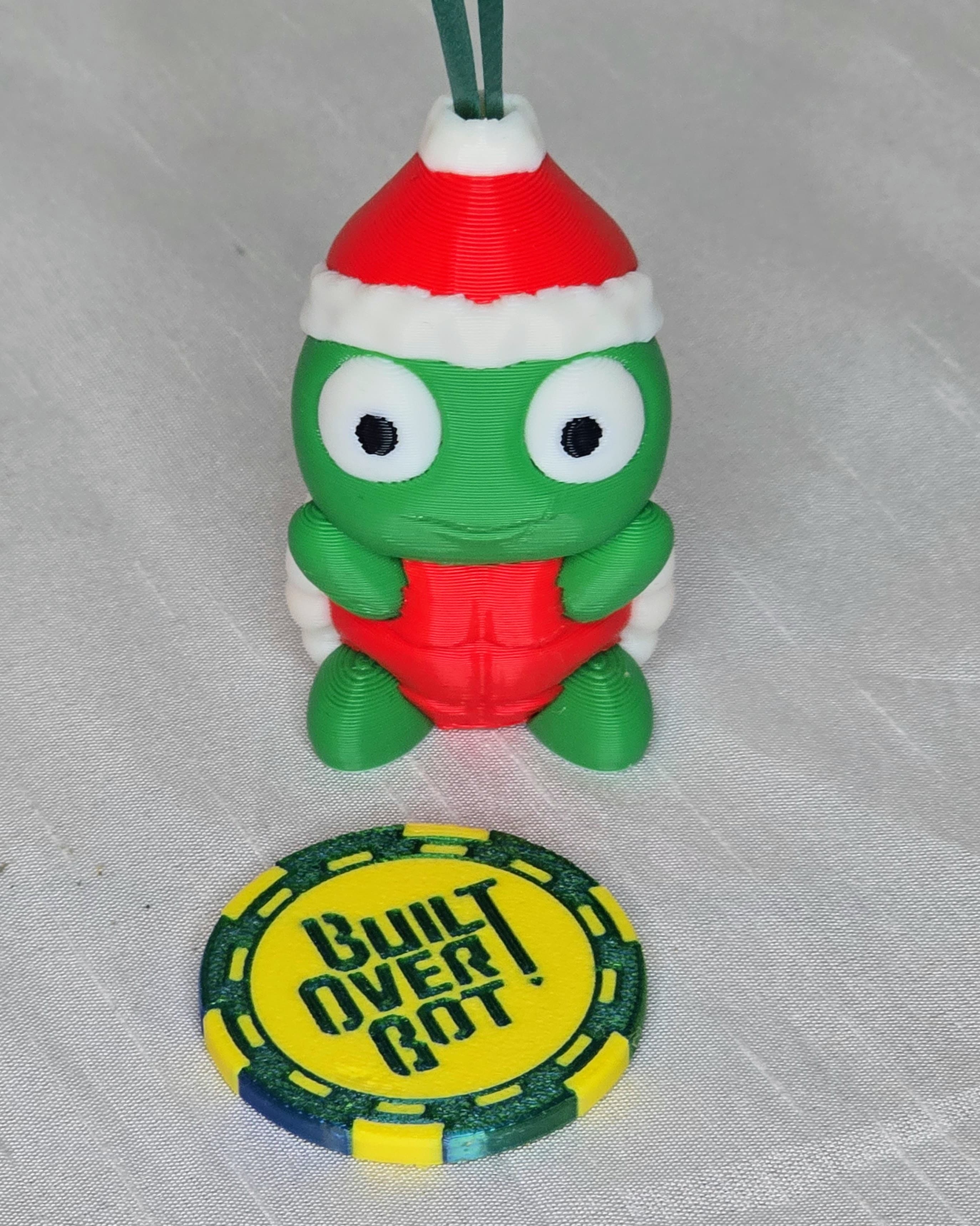 It's Santa Turtle. Printed in Polylite Red, White, Black and Green.