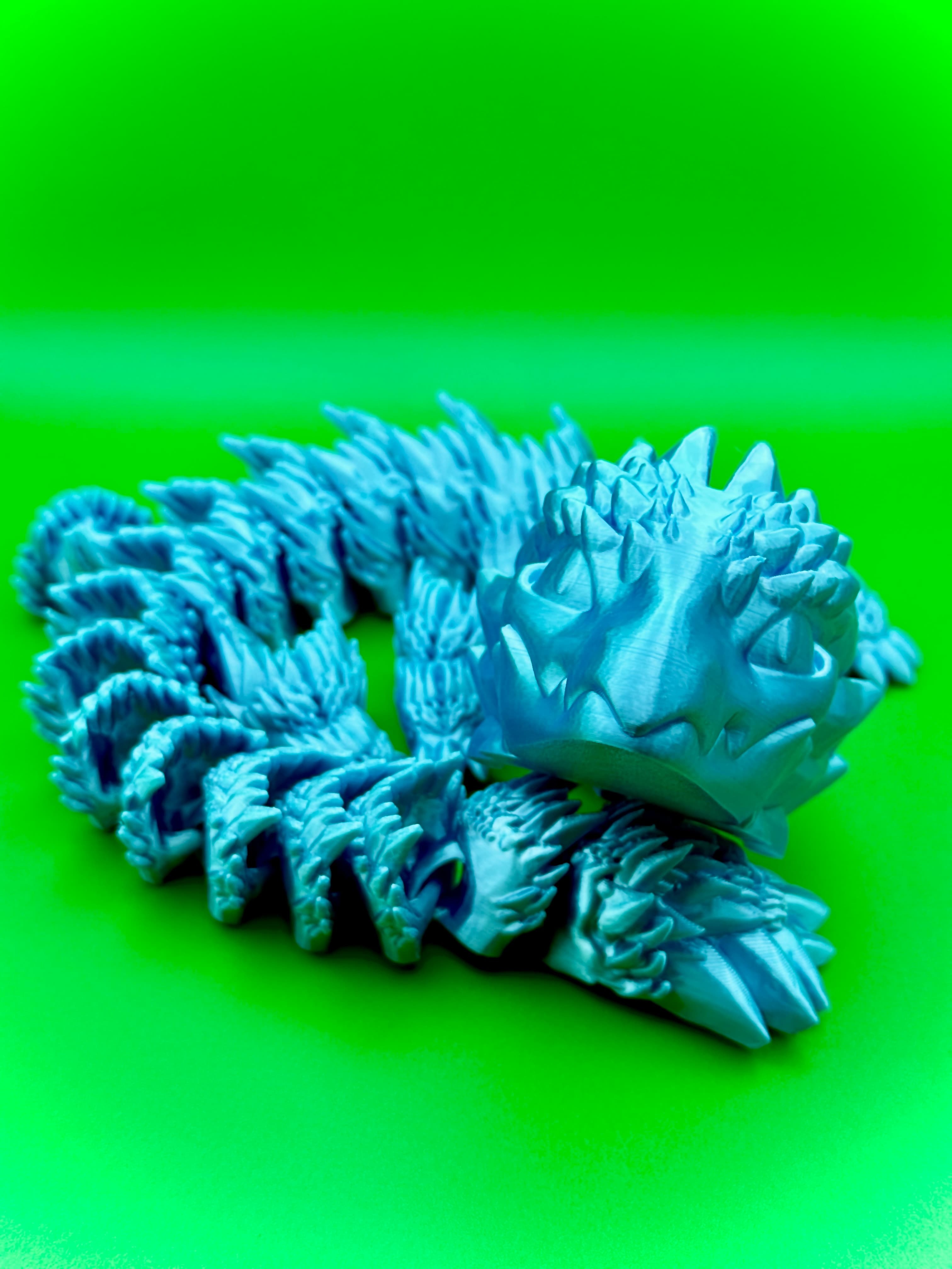 Printed in Jessie Elixir Aquamarine PLA, on a Prusa MK4S, no brim with a sliceworx dipped plate.