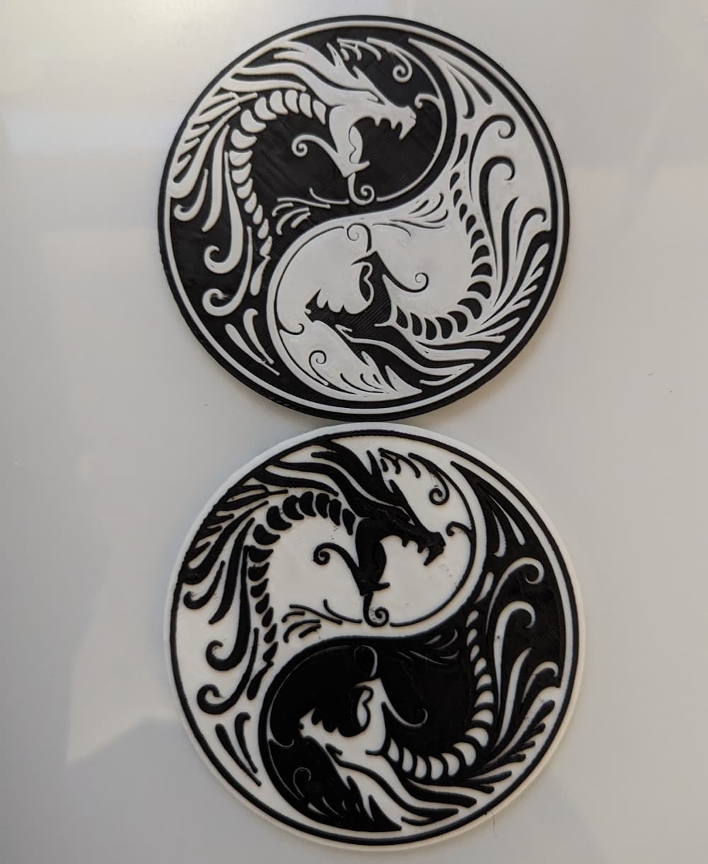 Shrunk the model by 50% on x and y which made them perfectly coaster sized, but mostly did that because I was short on both black and white filament.
I also used the Command M600 rather than M25 now that my printer supports that one.
(The whole story of that is in the comments of the models post)