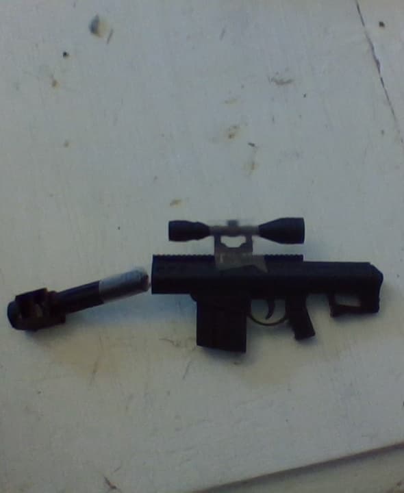 I may need to buy new plastic... In case you can't see it, that's scotch tape holding the barrel and scope on.