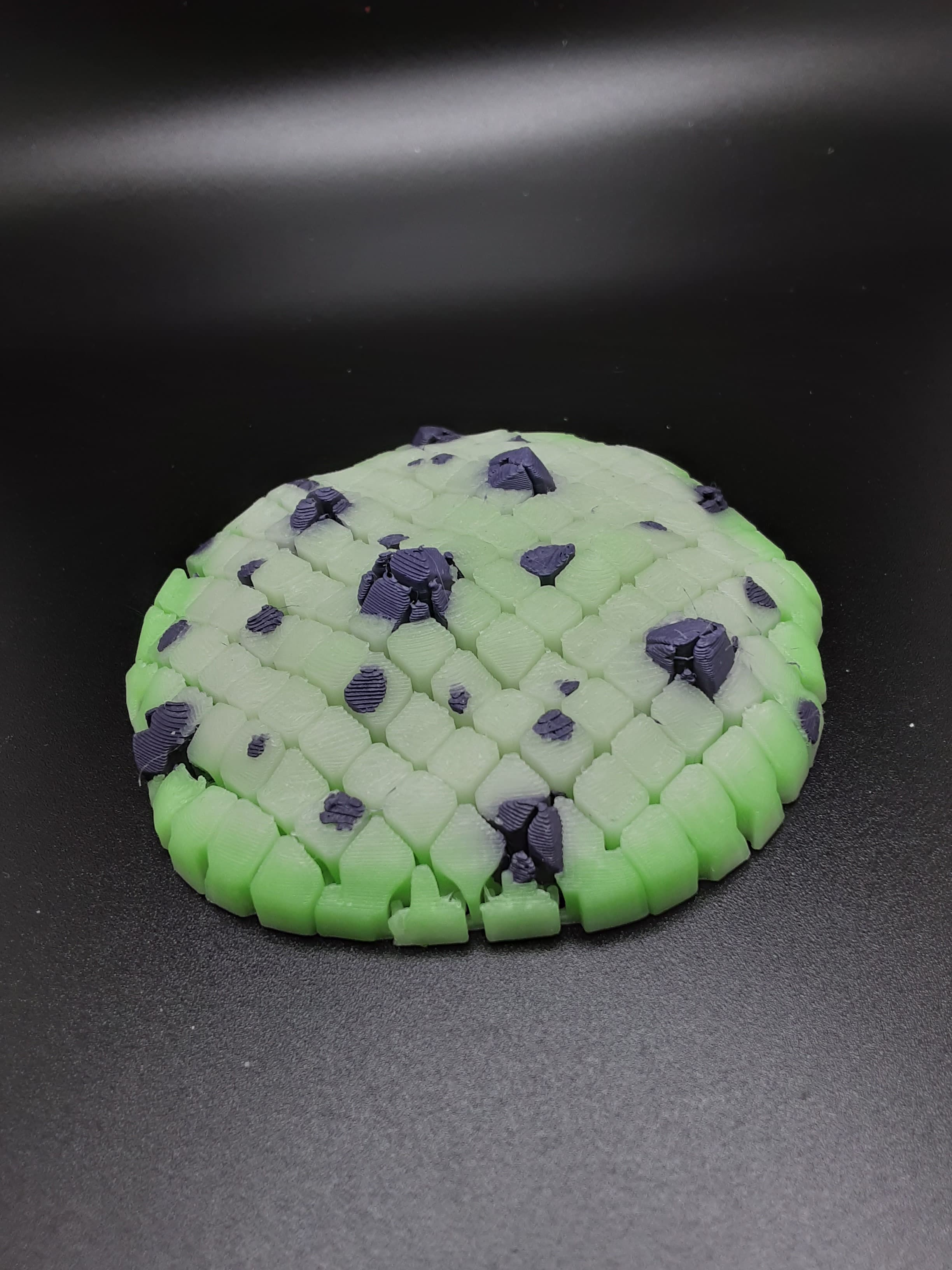 Done with Polymaker PLA Slime Glow Green and Ghastly Purple from the 2023 Halloween Bundle. Photos done with normal lighting, UV Black Light and no lighting (after charging under UV light).
