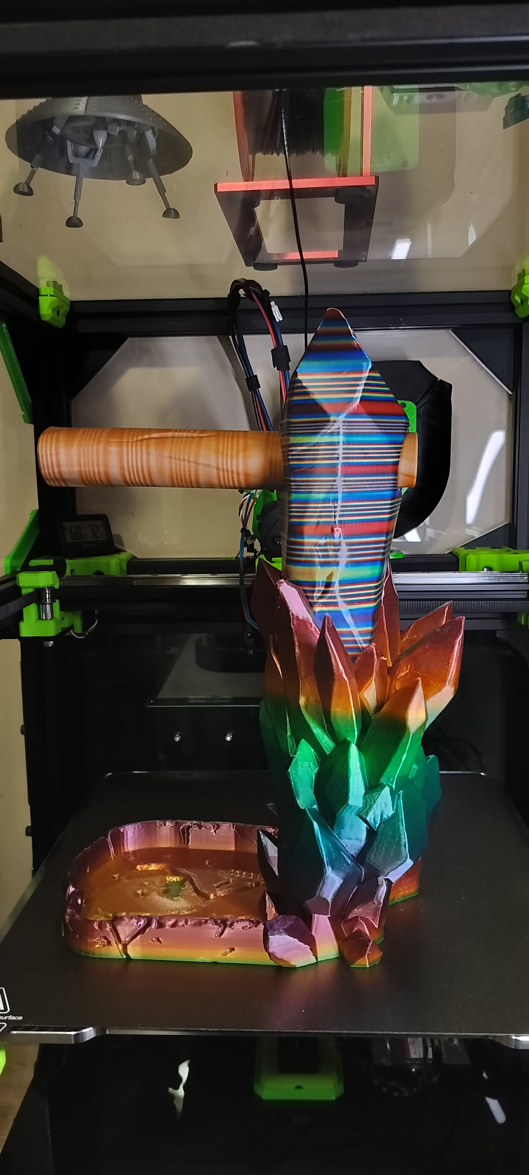 This was printed with 3 different Amolen filaments:
1. Base: Amolen Rainbow PETG
2. Crystal: Amolen Shiny Multicolor Rainbow PLA Filament Blue Red YellowGreen (tri-extrusion with twists)
3. Peg: Amolen Grain Wood PLA
This is a really cool object and printed like a champ with 15% Lightning infill. I love how the 3 filaments compliment each other.