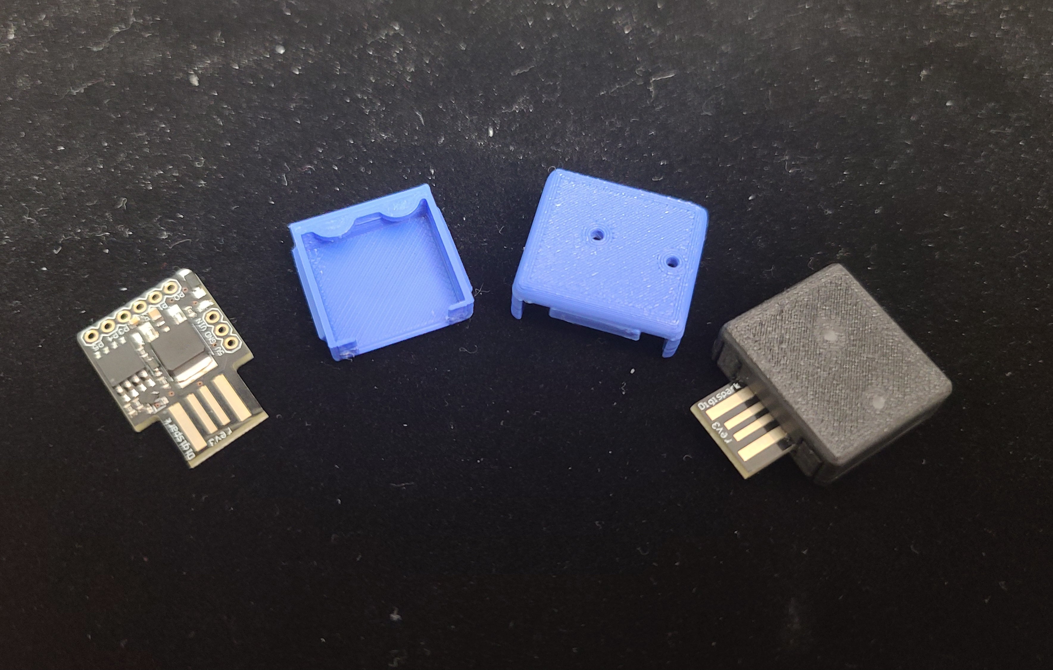 I added two holes for the on-board LEDs, with "light guides" made of clear filament glued in place.