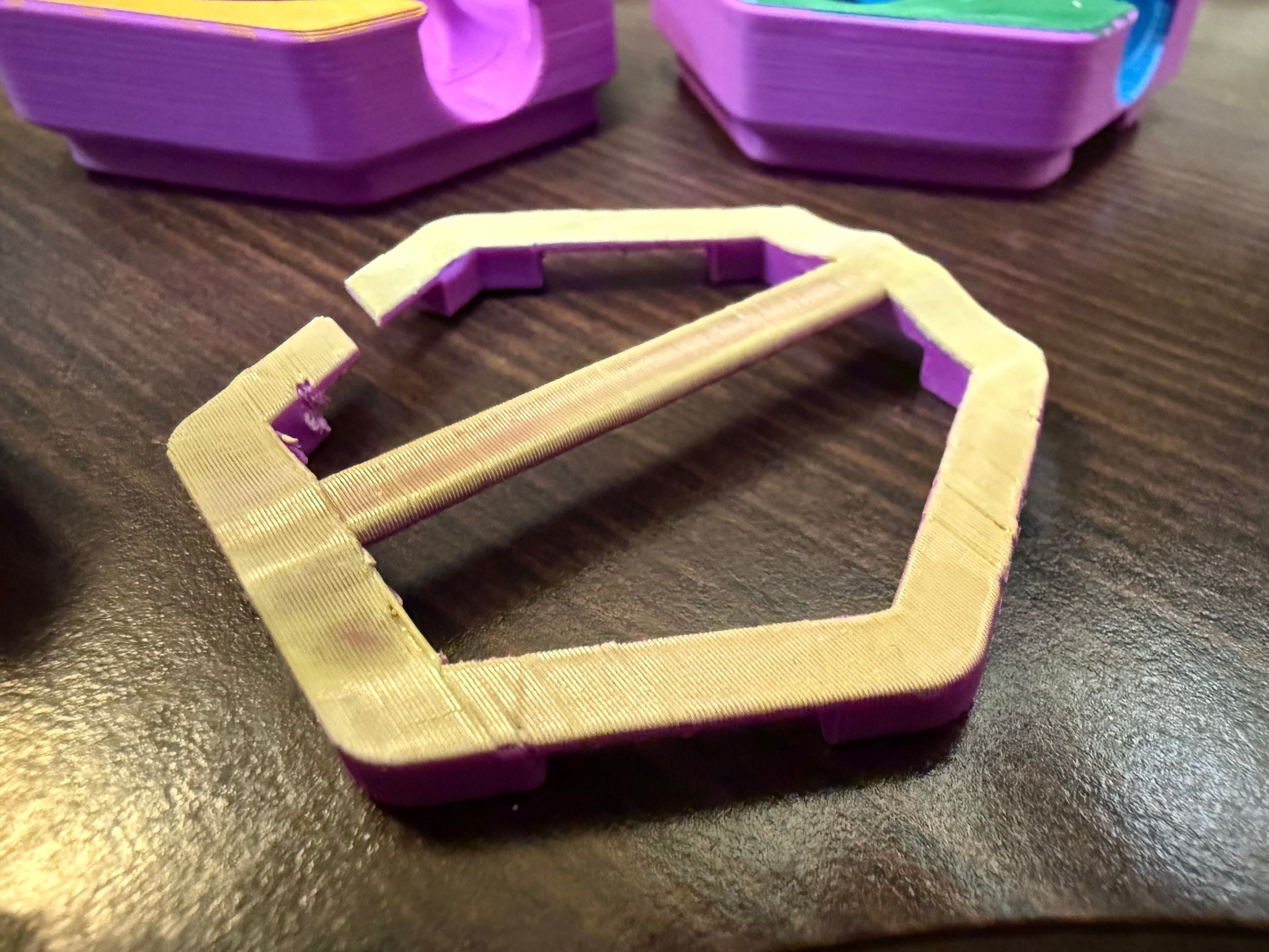 I printed it on its end. And it mostly worked. Removing one of the sacrificial supports split the edge pretty cleanly. But I'm not disappointed in the result. Clever idea!