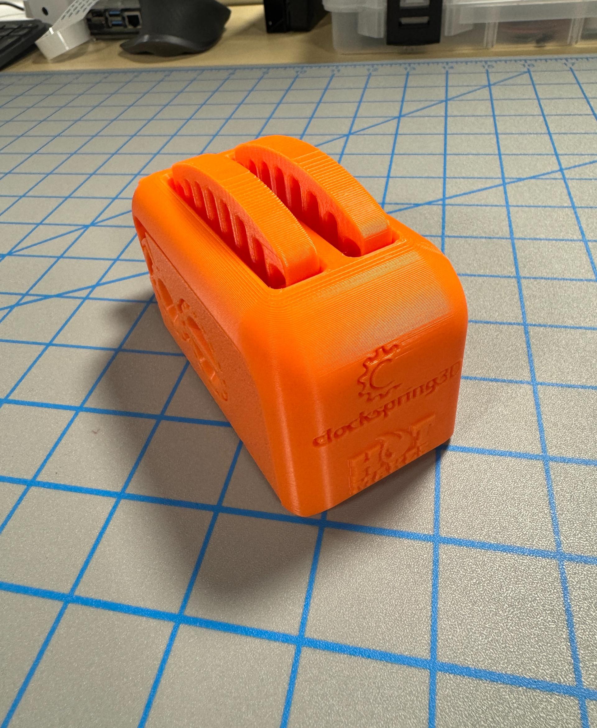 Clockspring3D Torture Toaster - Bambu P1S using Bambu standard orange PLA. All default settings, and it all works. - 3d model