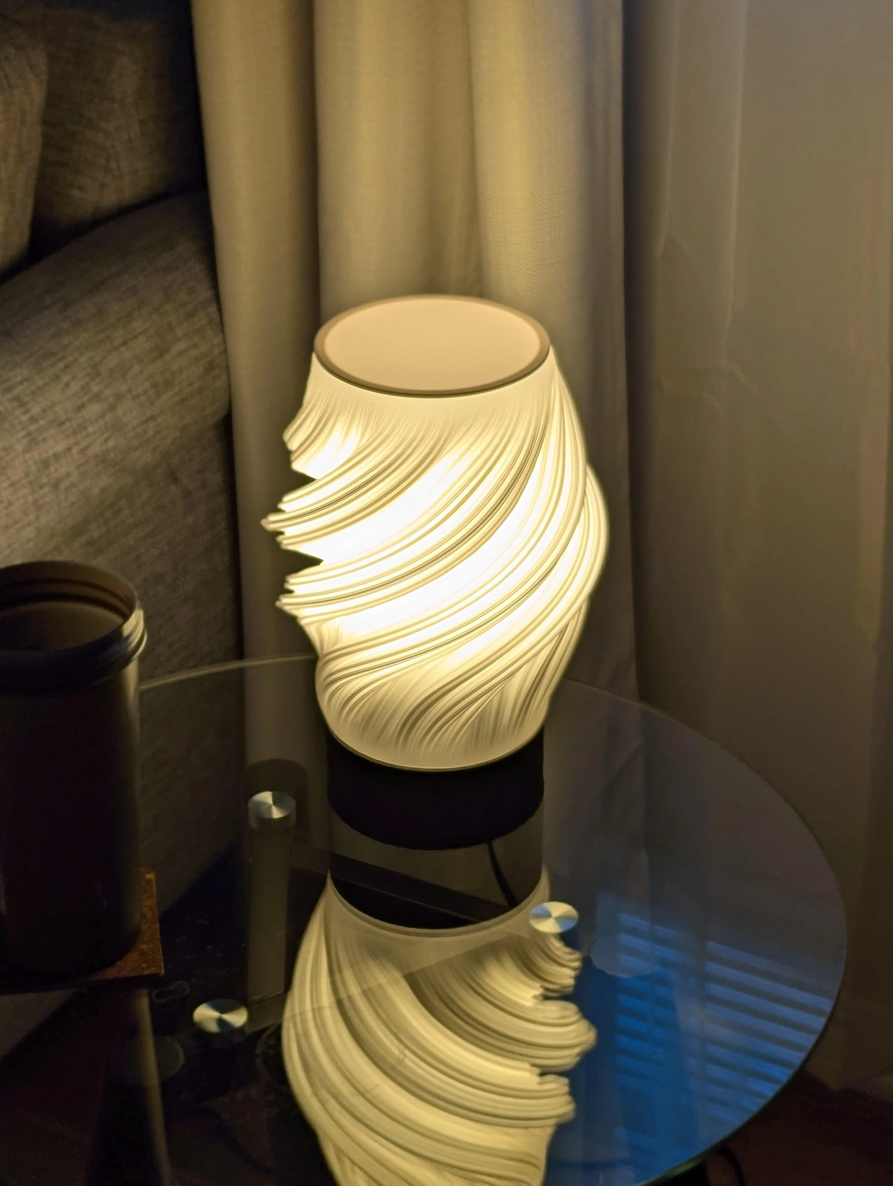 Love how this looks! Unfortunately my socket didn't fit well with the base - it'd be very helpful if the author provided a link/dimensions to the socket used.
Had to modify the base to be taller to accommodate the socket, and I also wanted the bulb to be centered within the lamp. Also updated the cutout for the cord.
I'm using a 40 watt A19 LED bulb.
Also created a simple lid so that this wasn't creating an upward spotlight.
0.2 layer height with 0.8 layer width for structure/diffusion.